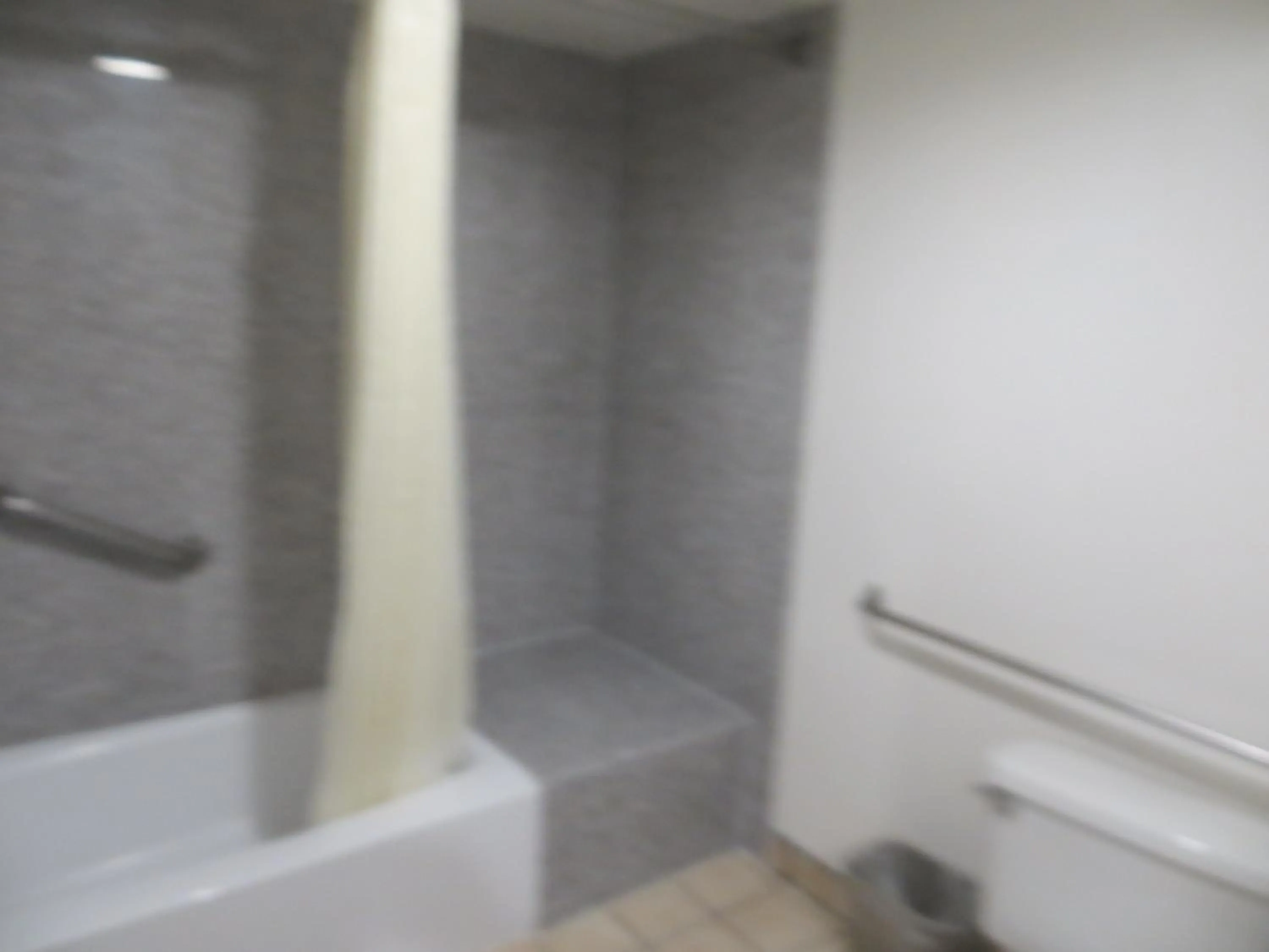 Toilet in Riverside Inn & Suites