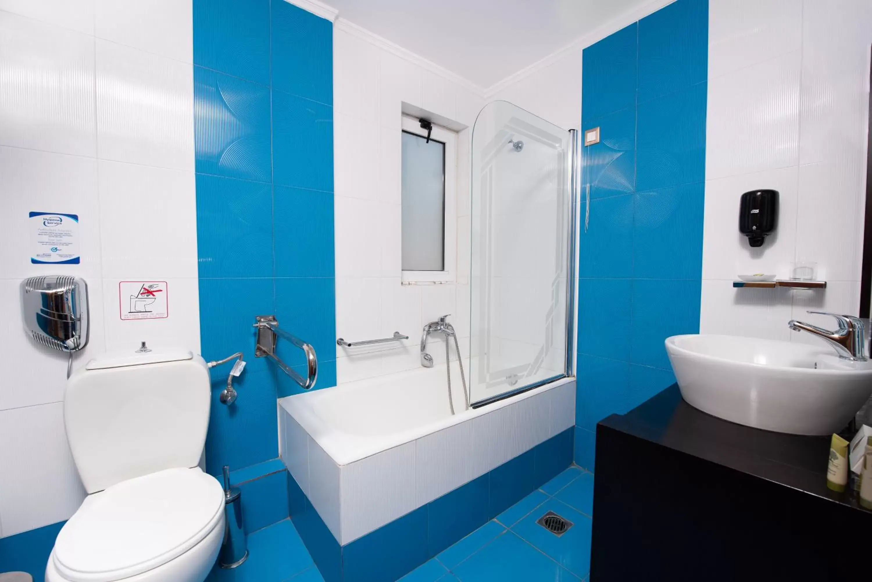 Toilet, Bathroom in Heliotrope Hotels