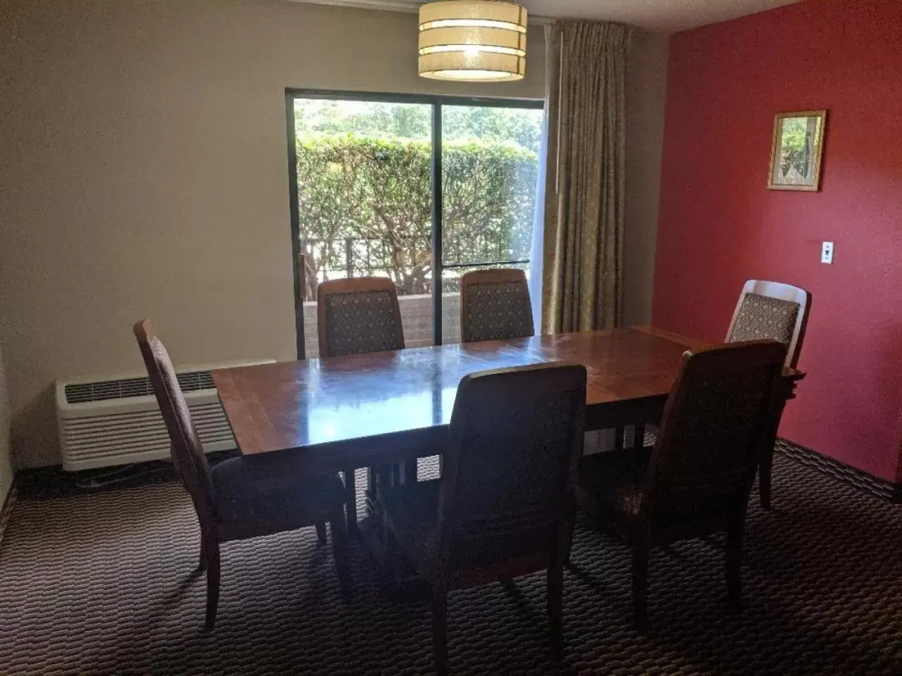Living room, Dining Area in Ramada by Wyndham Raleigh