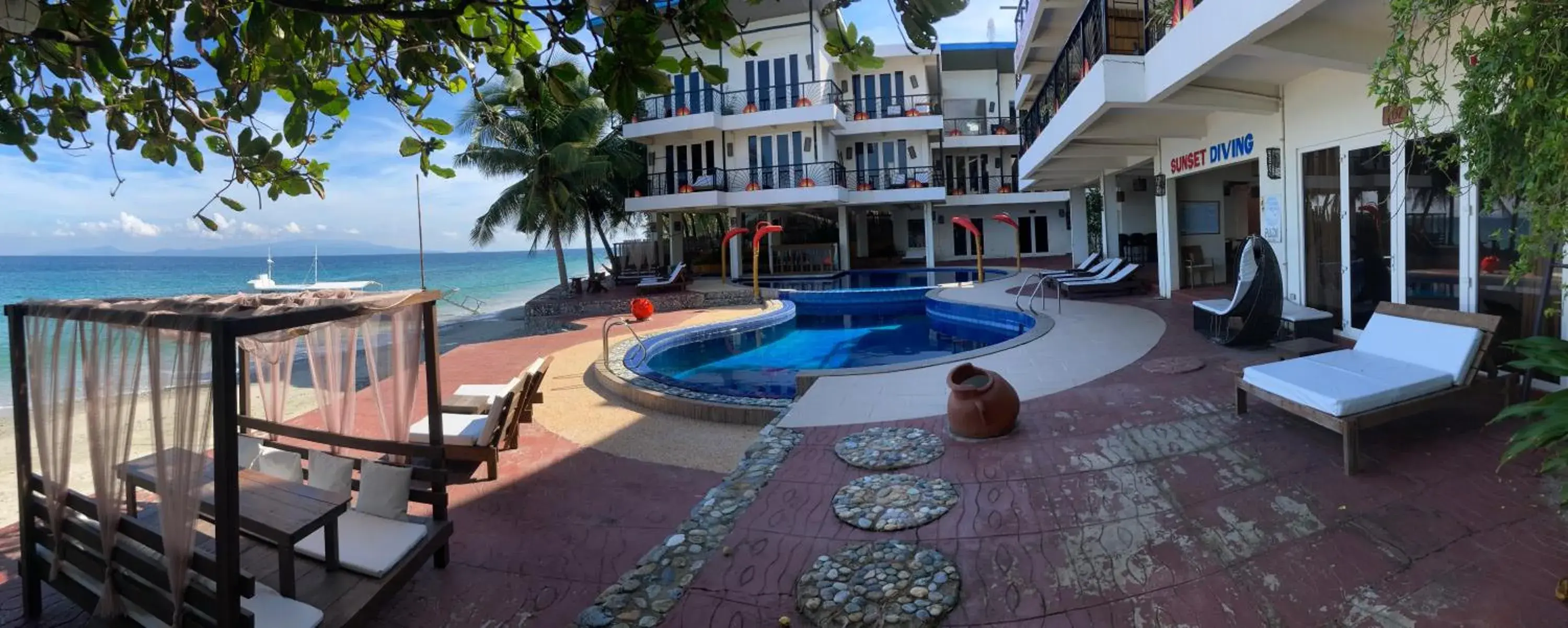 Pool view, Swimming Pool in Sunset At Aninuan Beach Resort