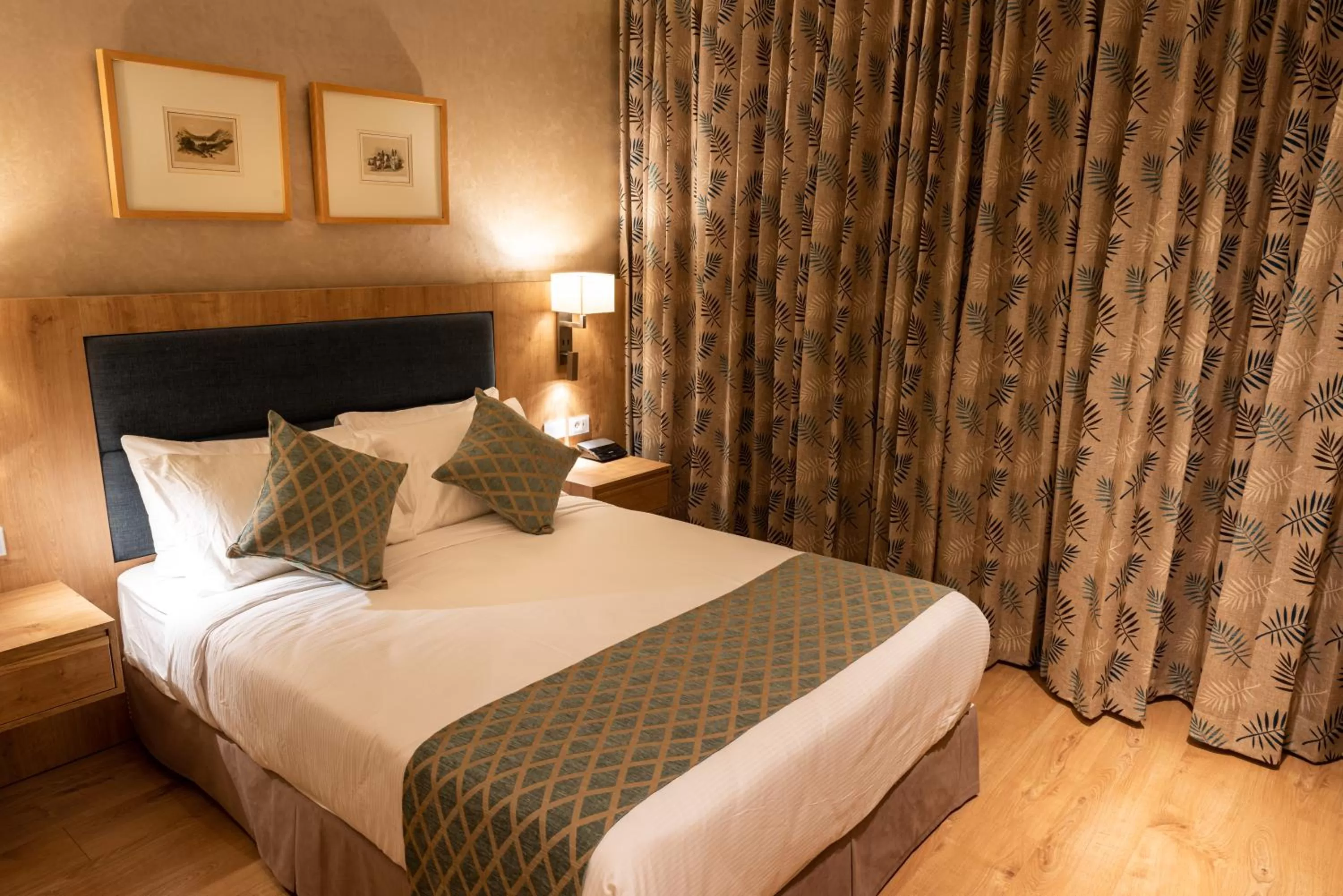 Bed in Ambassador Boutique Hotel