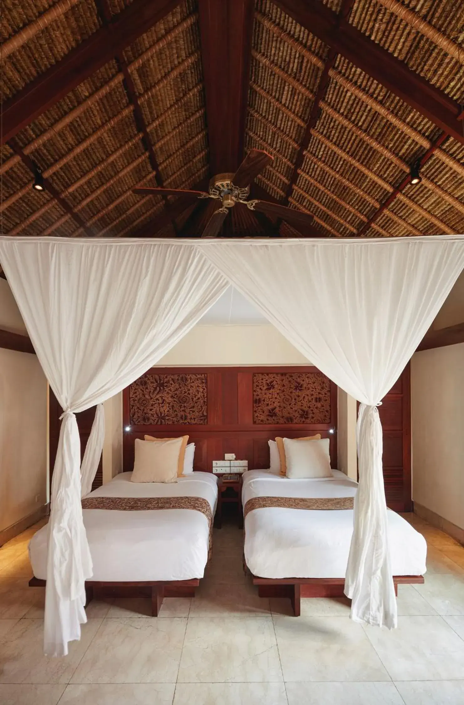 Bed in Jimbaran Puri, A Belmond Hotel, Bali