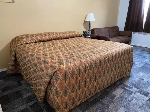 Bed in Americas Best Value Inn