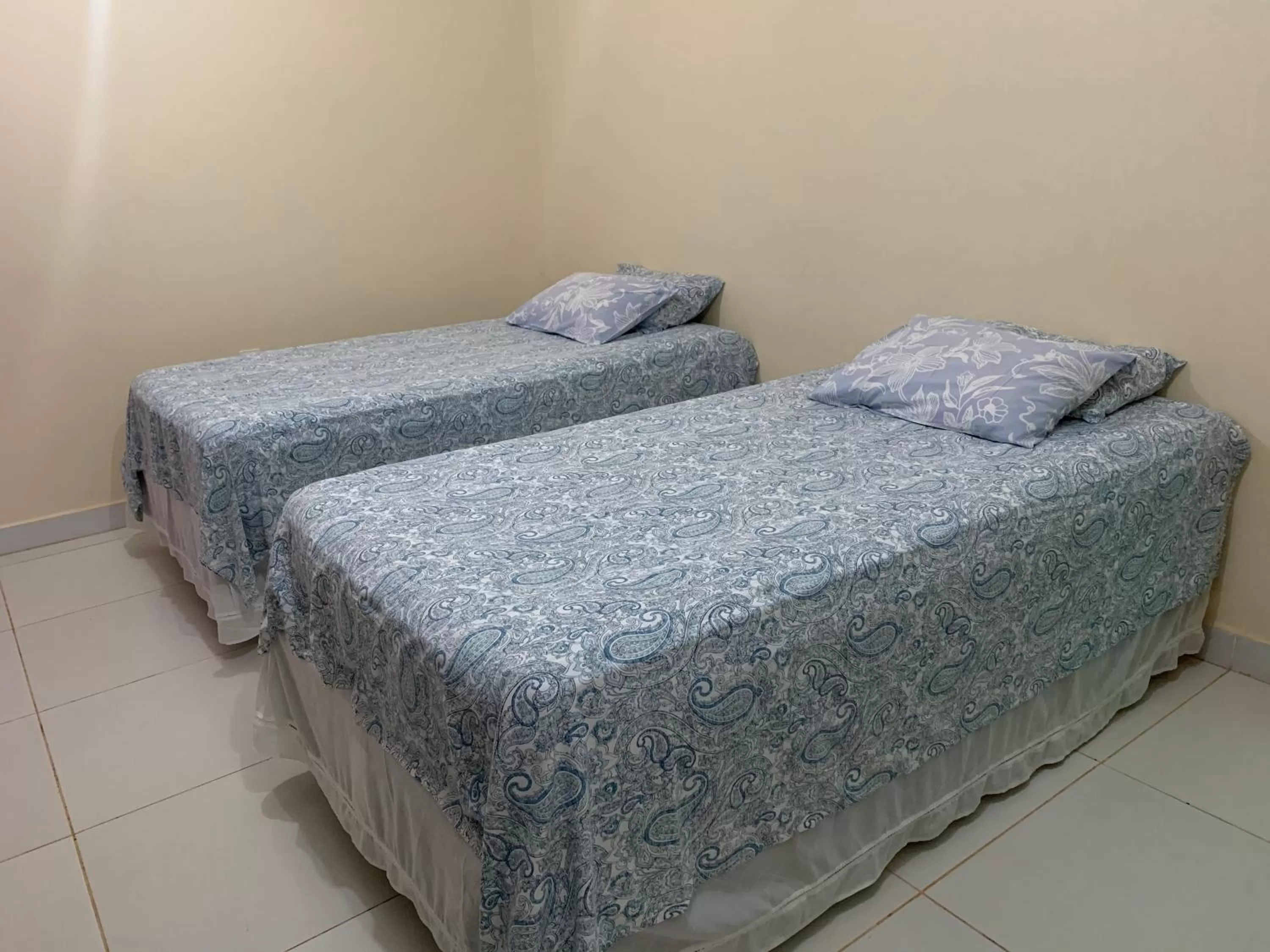 Bed in Pousada Jardim Brasília