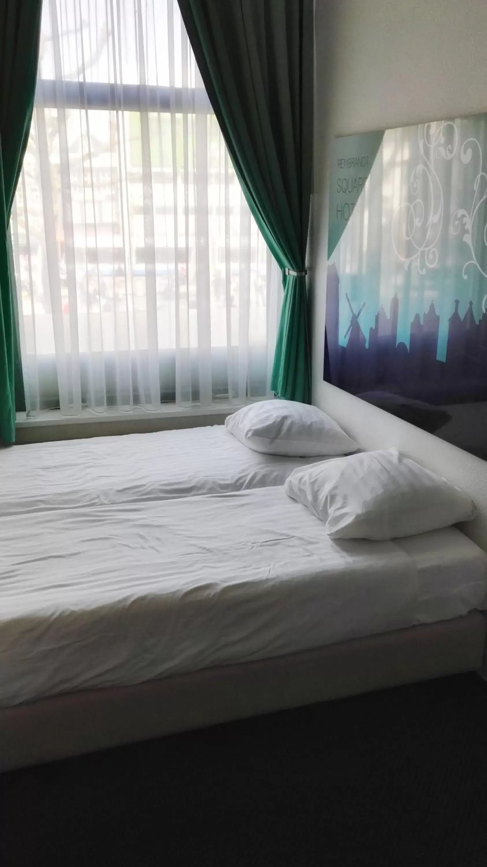 Bed in Rembrandt Square Hotel