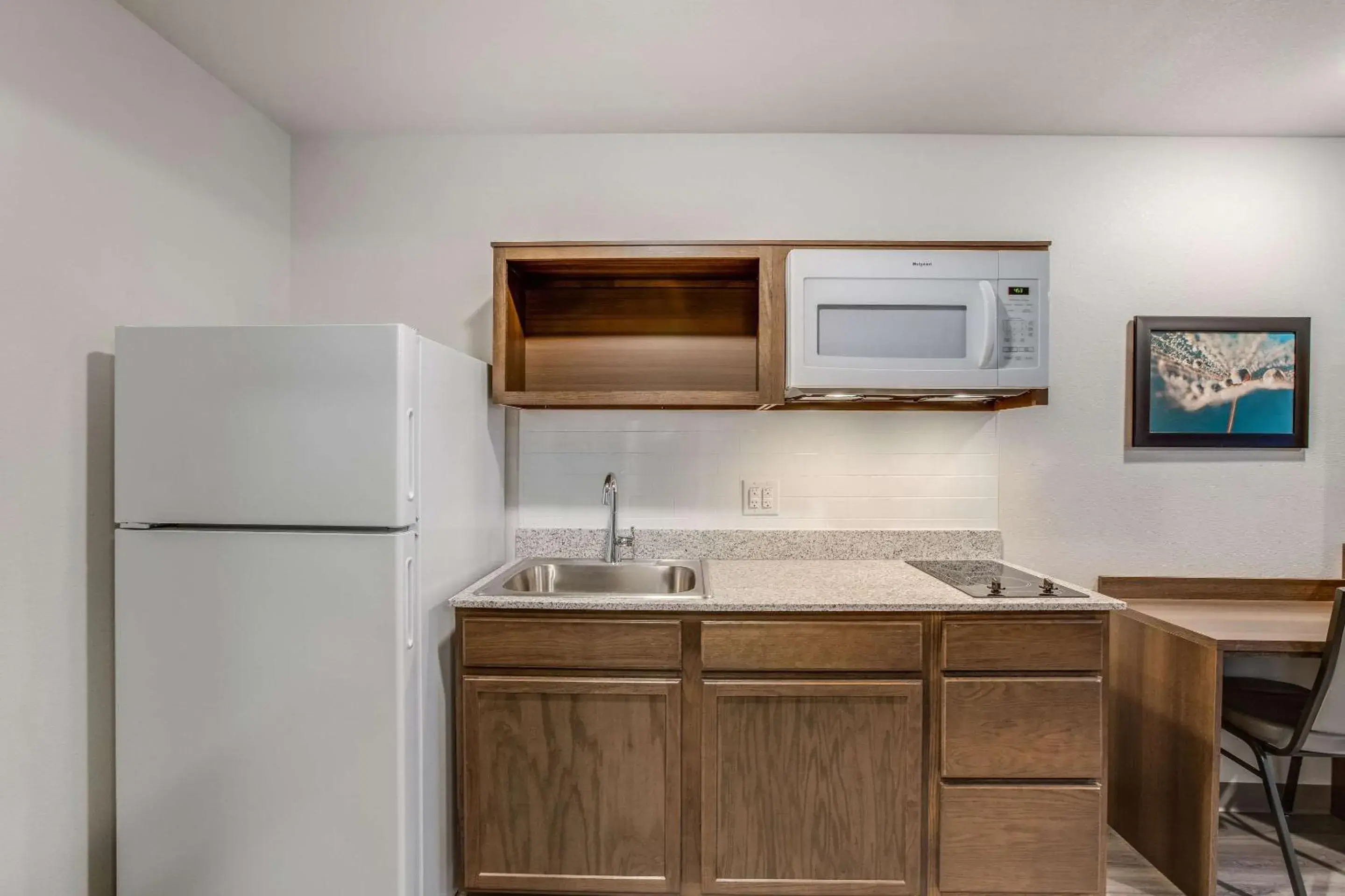 Photo of the whole room, Kitchen/Kitchenette in WoodSpring Suites Detroit Farmington Hills