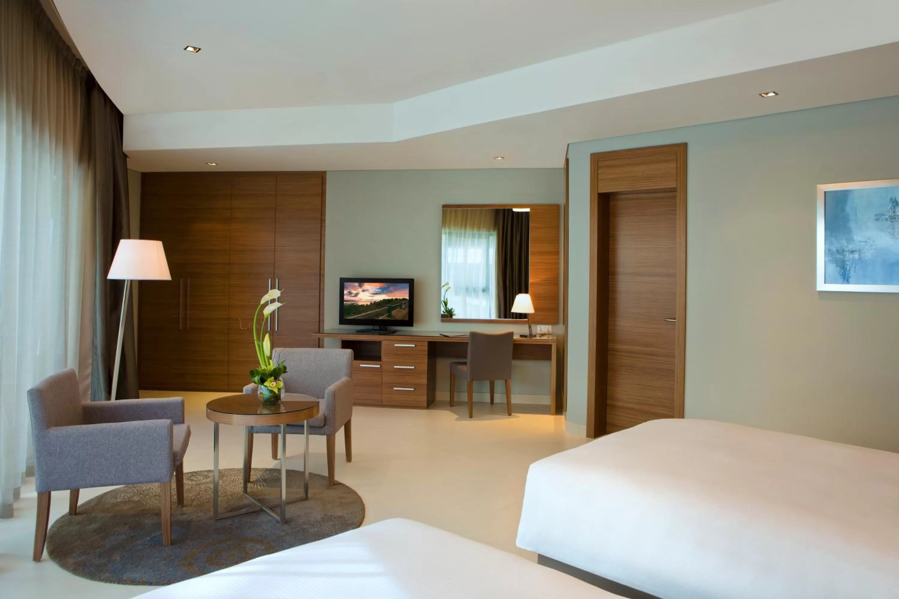 Photo of the whole room, Bed in Majestic Arjaan by Rotana – Manama