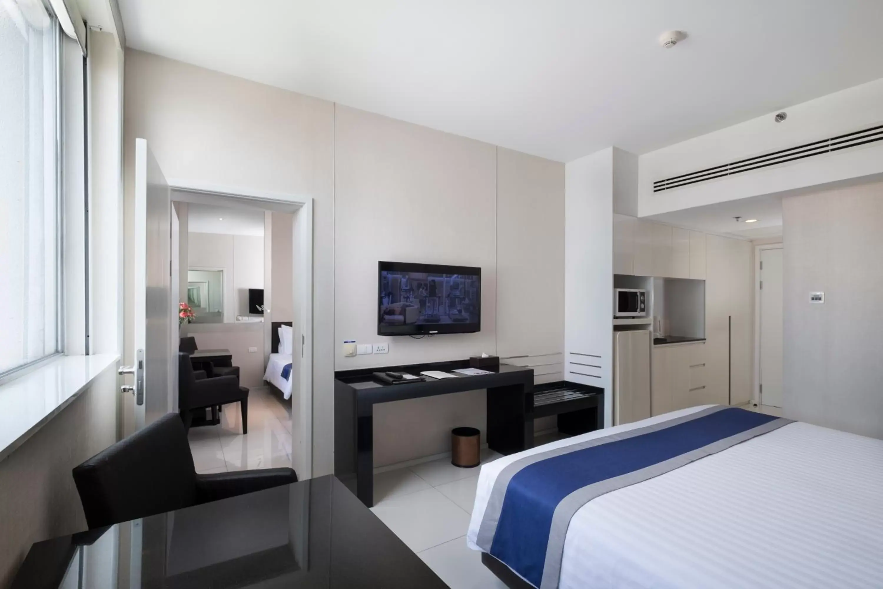 Bed, TV/Entertainment Center in Mandarin Hotel Managed by Centre Point