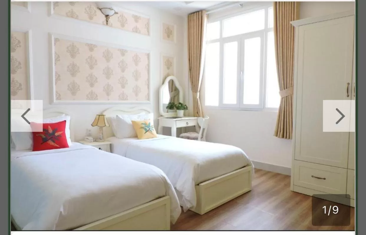 Bed in Chez Lotus Rose