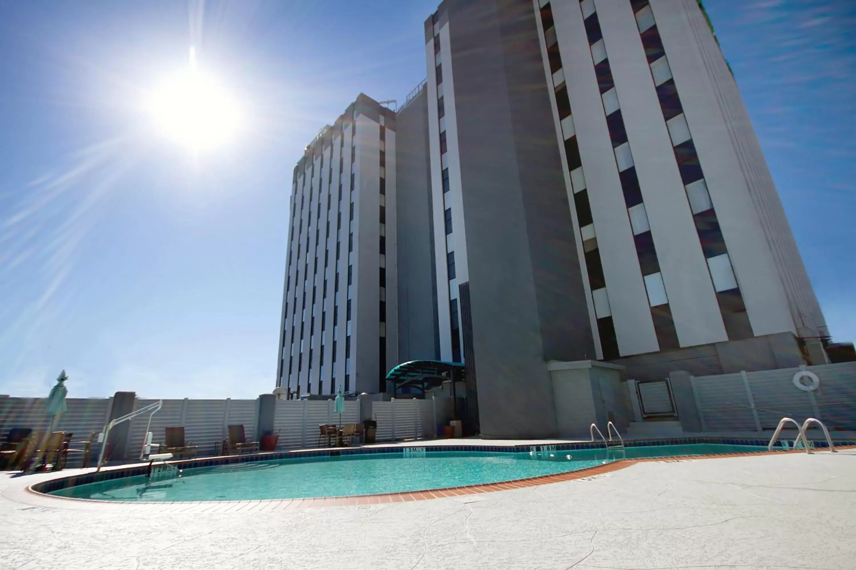 Swimming pool, Property Building in Holiday Inn Metairie New Orleans, an IHG Hotel
