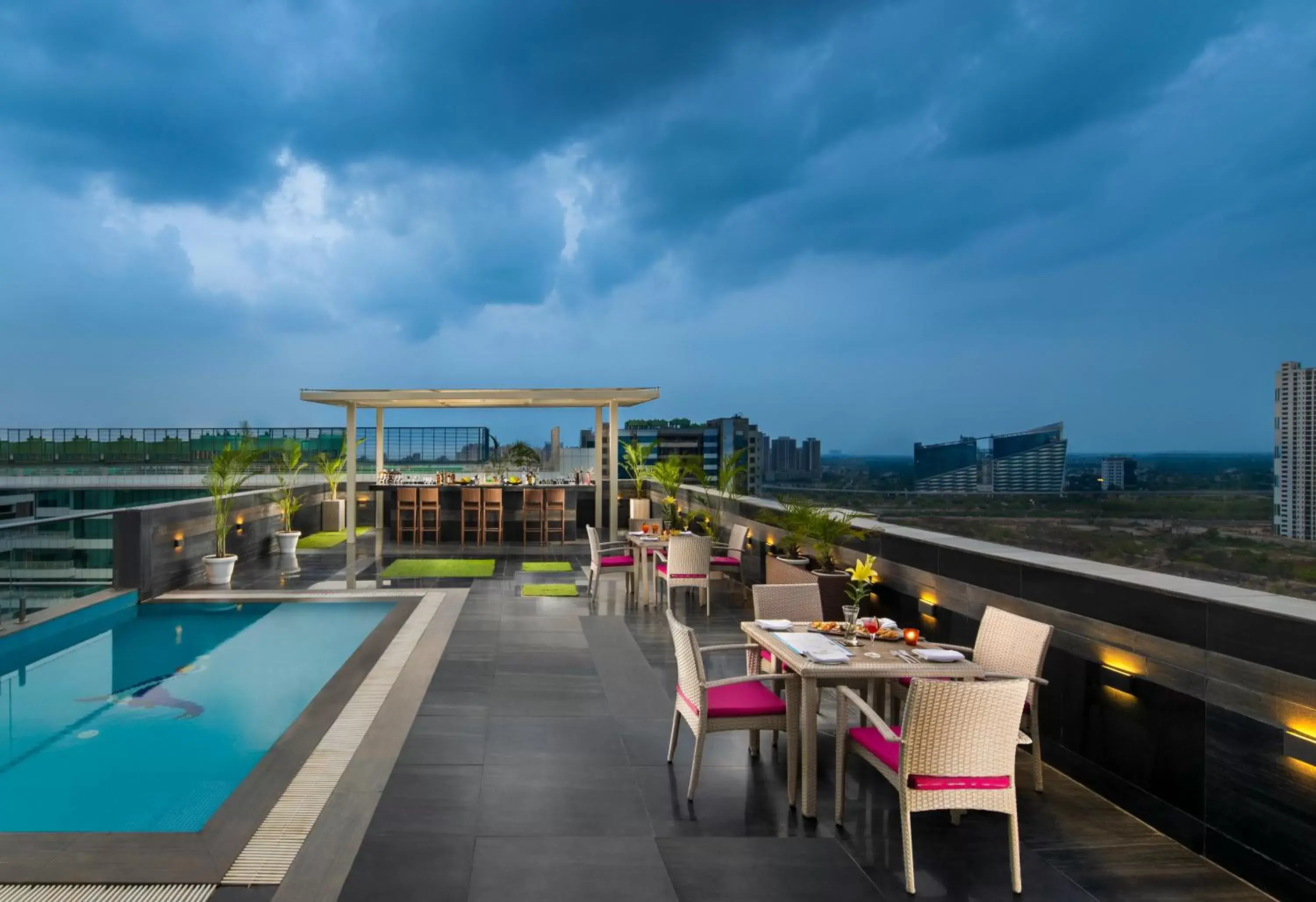 Lounge or bar, Pool View in Sandal Suites by Lemon Tree Hotels