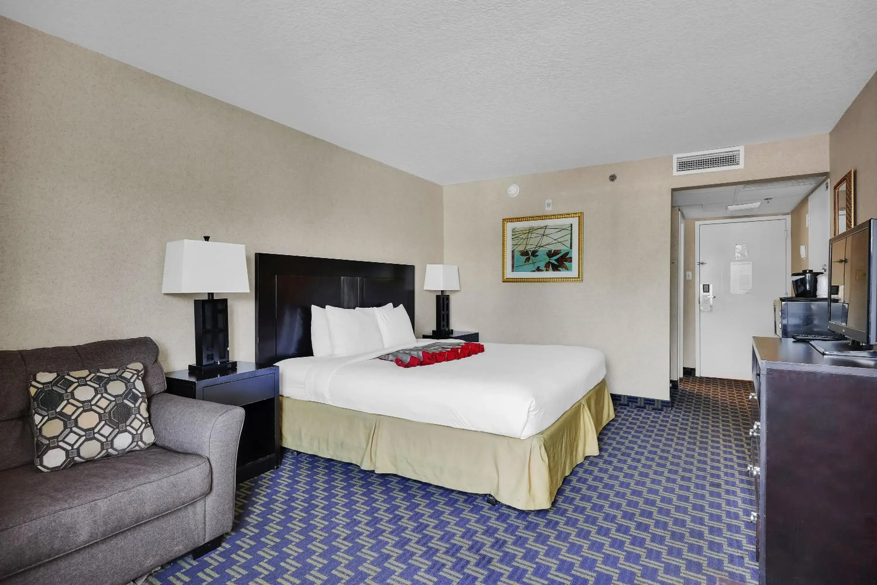 Bed in Ramada by Wyndham Jacksonville I-95 by Butler Blvd