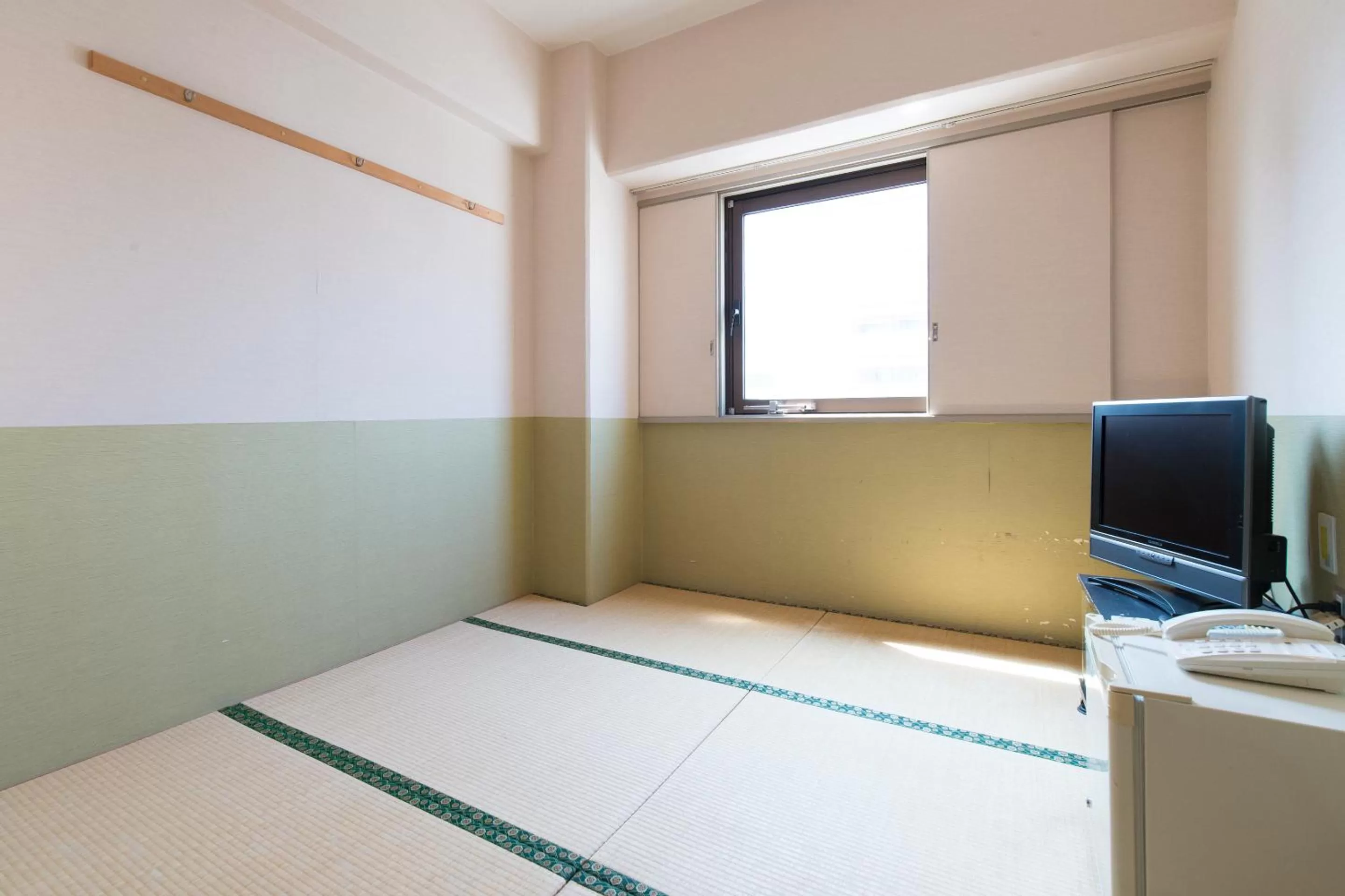 Photo of the whole room, Bed in Tabist Hotel Tetora Kitakyushu