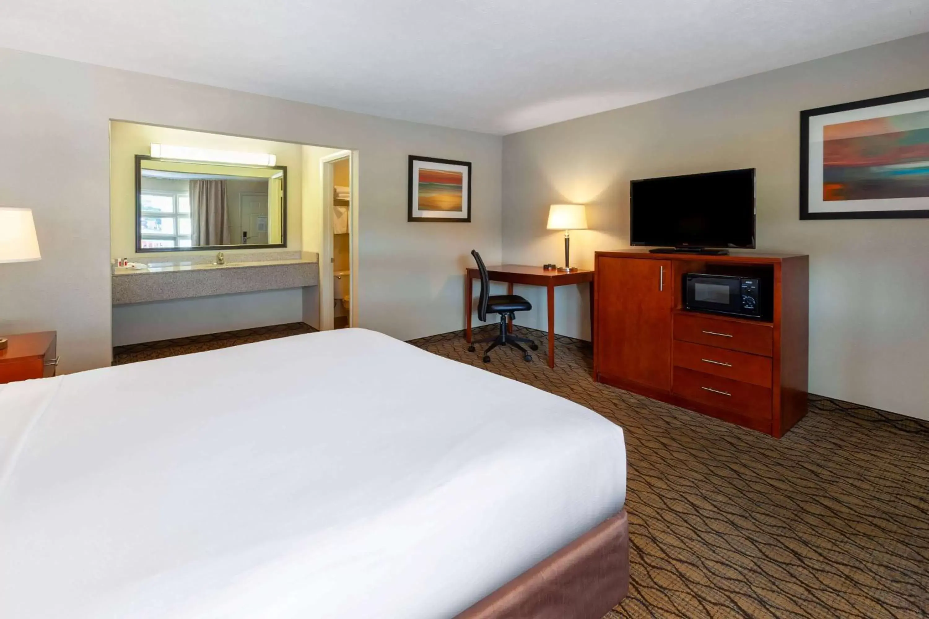 Photo of the whole room, Bed in Baymont by Wyndham St. Ignace Lakefront