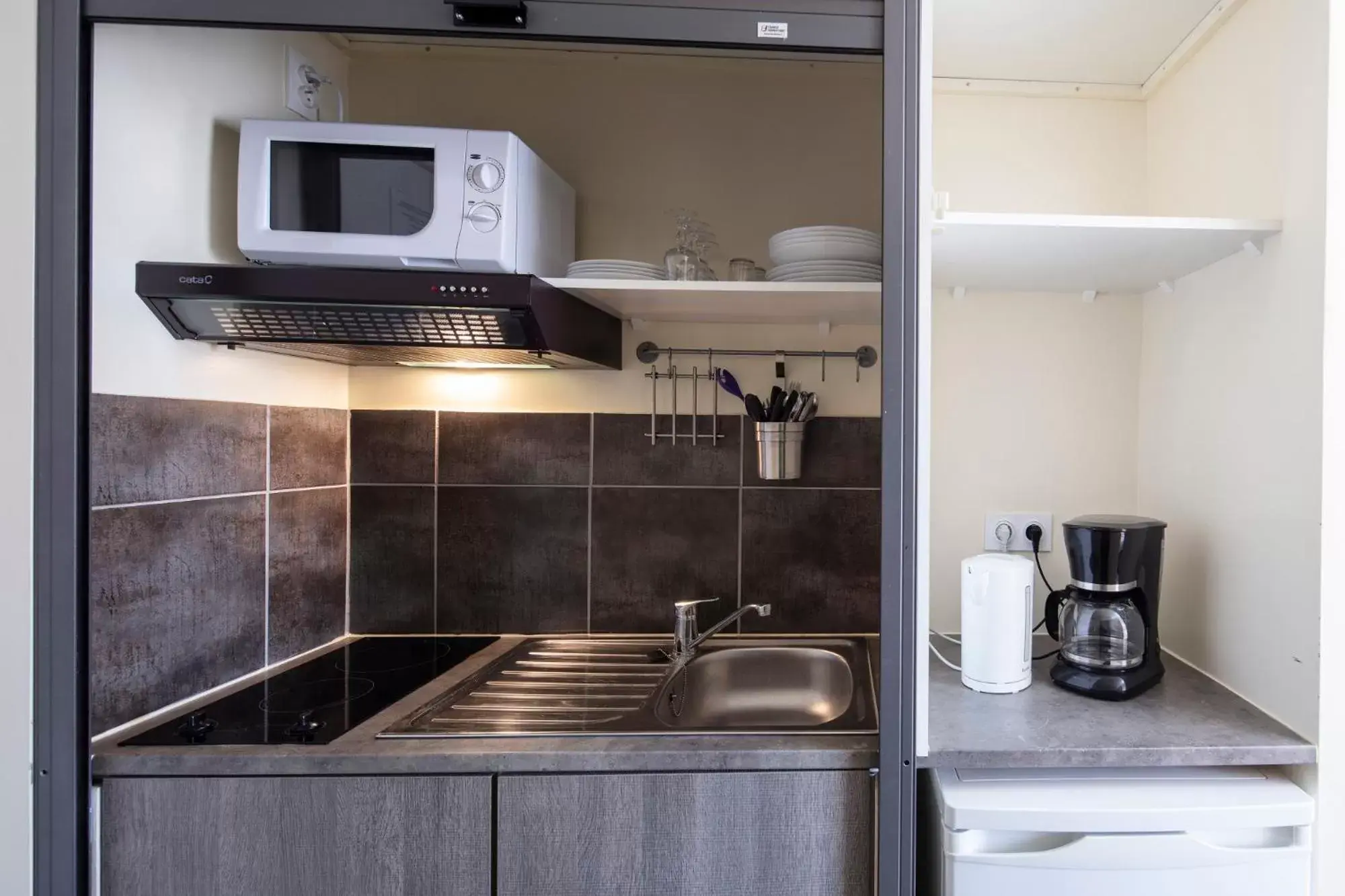 Kitchen/Kitchenette in Hotel Les Rocailles