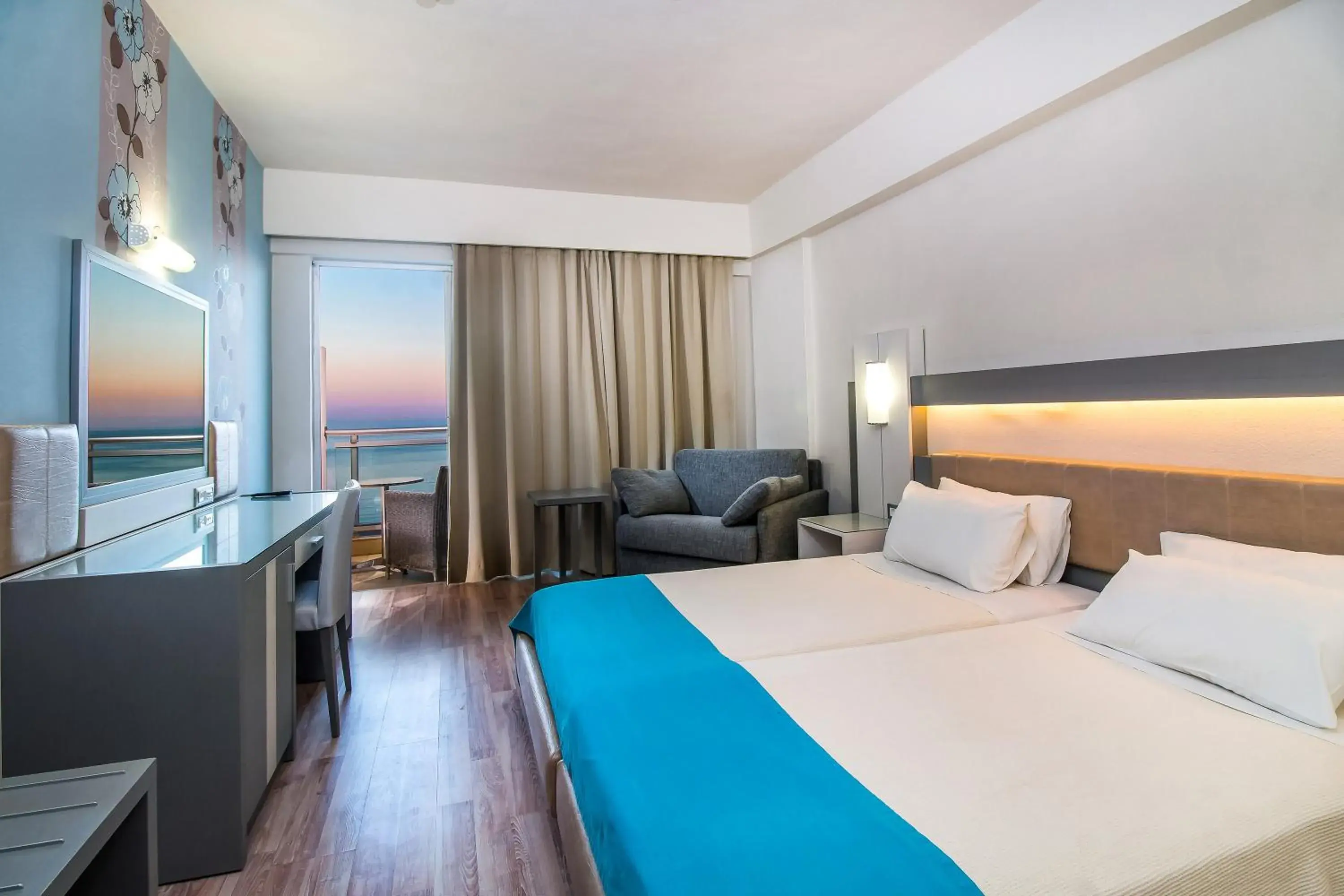 Bedroom in Pegasos Deluxe Beach Hotel