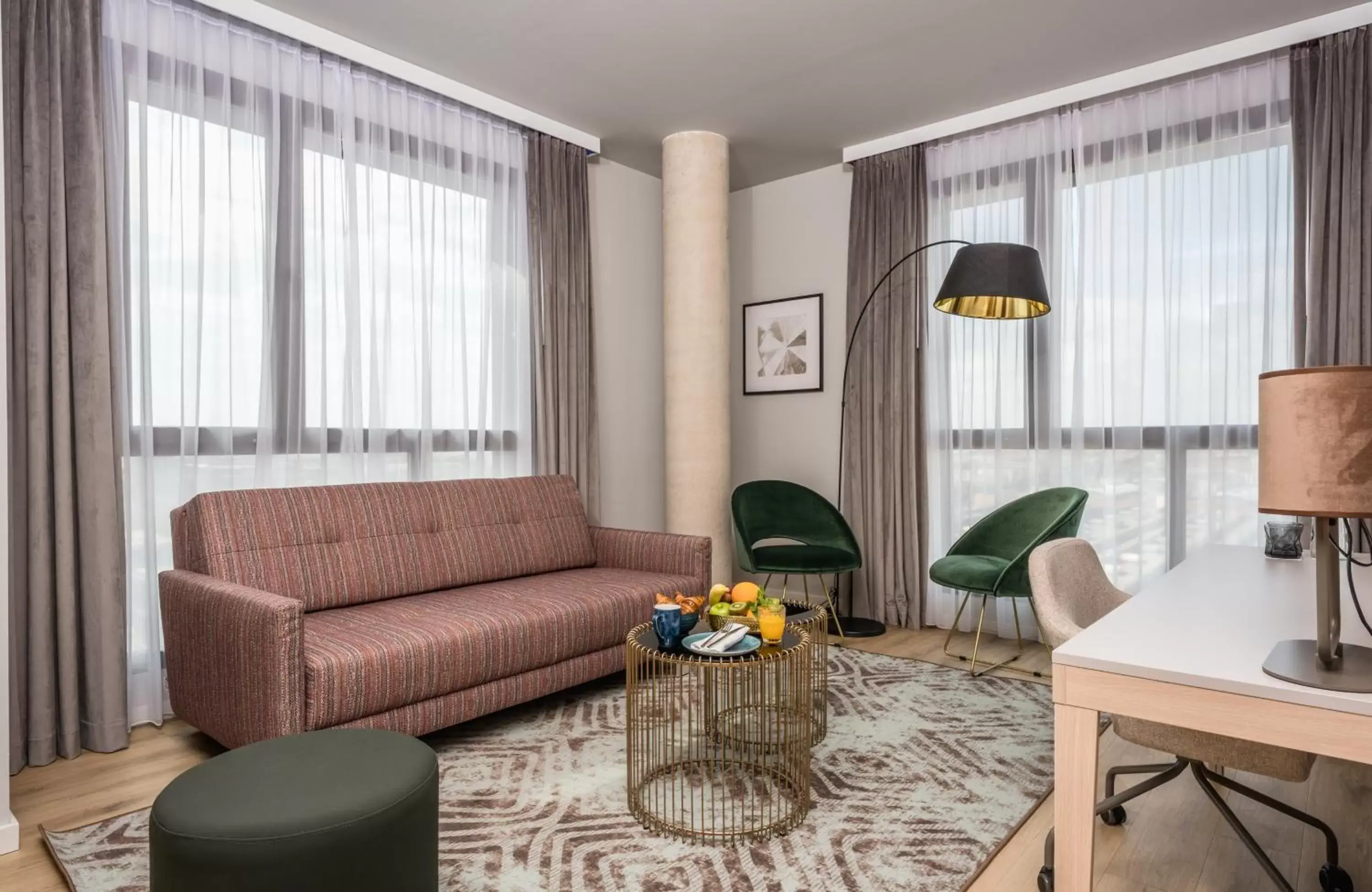 Photo of the whole room, Seating Area in Leonardo Royal Hotel Barcelona Fira