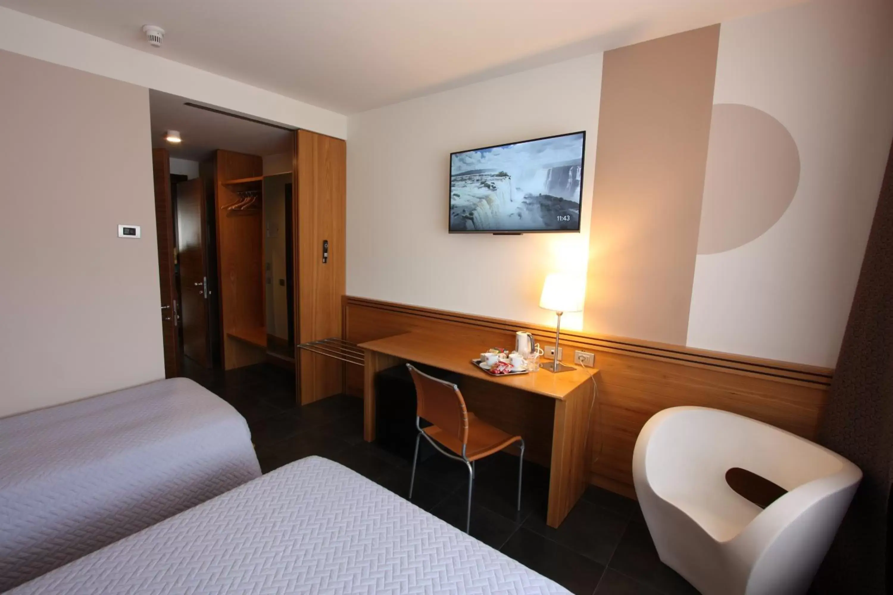 Photo of the whole room, TV/Entertainment Center in Hotel Europa Belluno