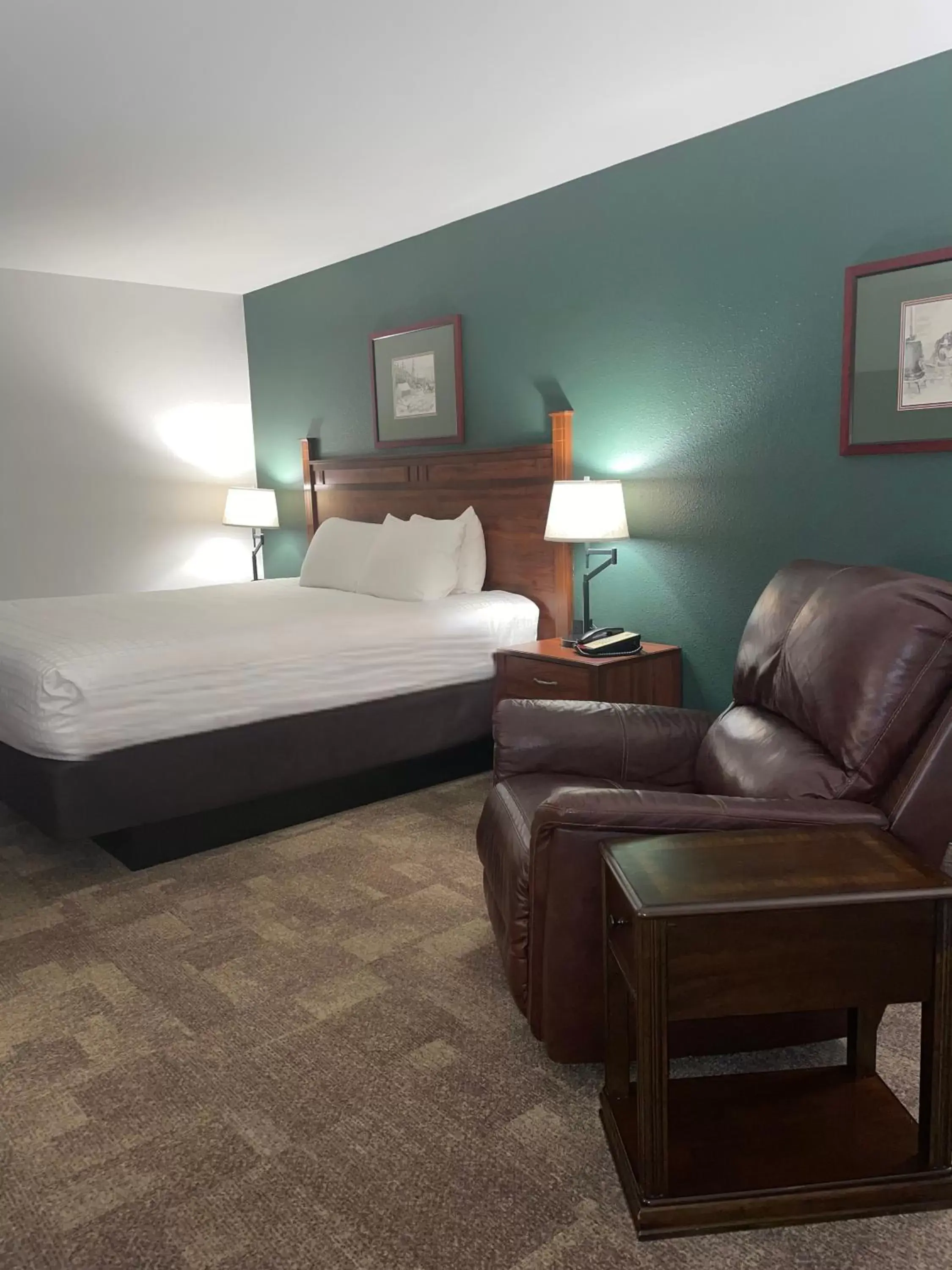 Bed in Boothill Inn and Suites
