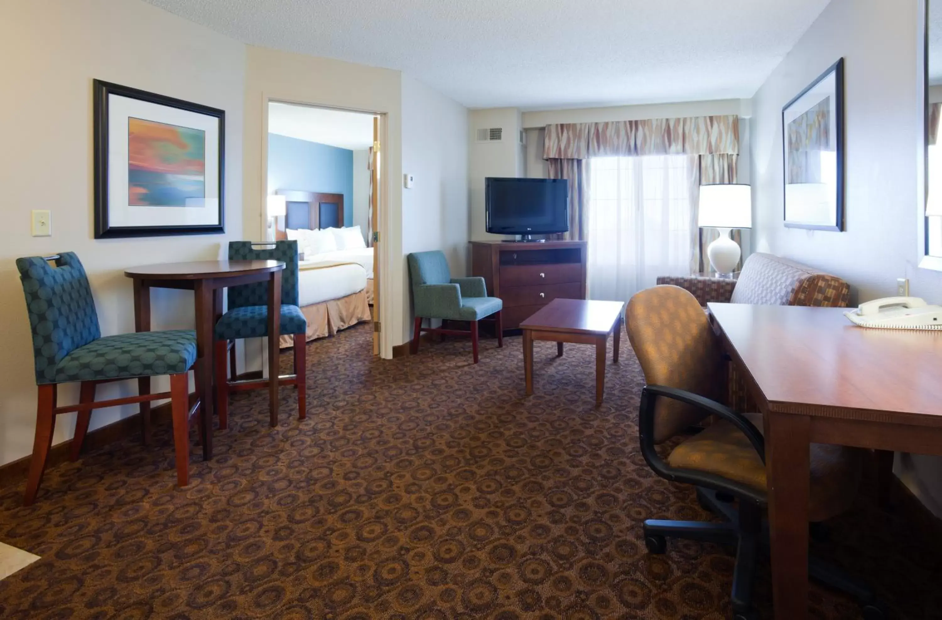 Bedroom, Dining Area in Holiday Inn Express and Suites St. Cloud, an IHG Hotel