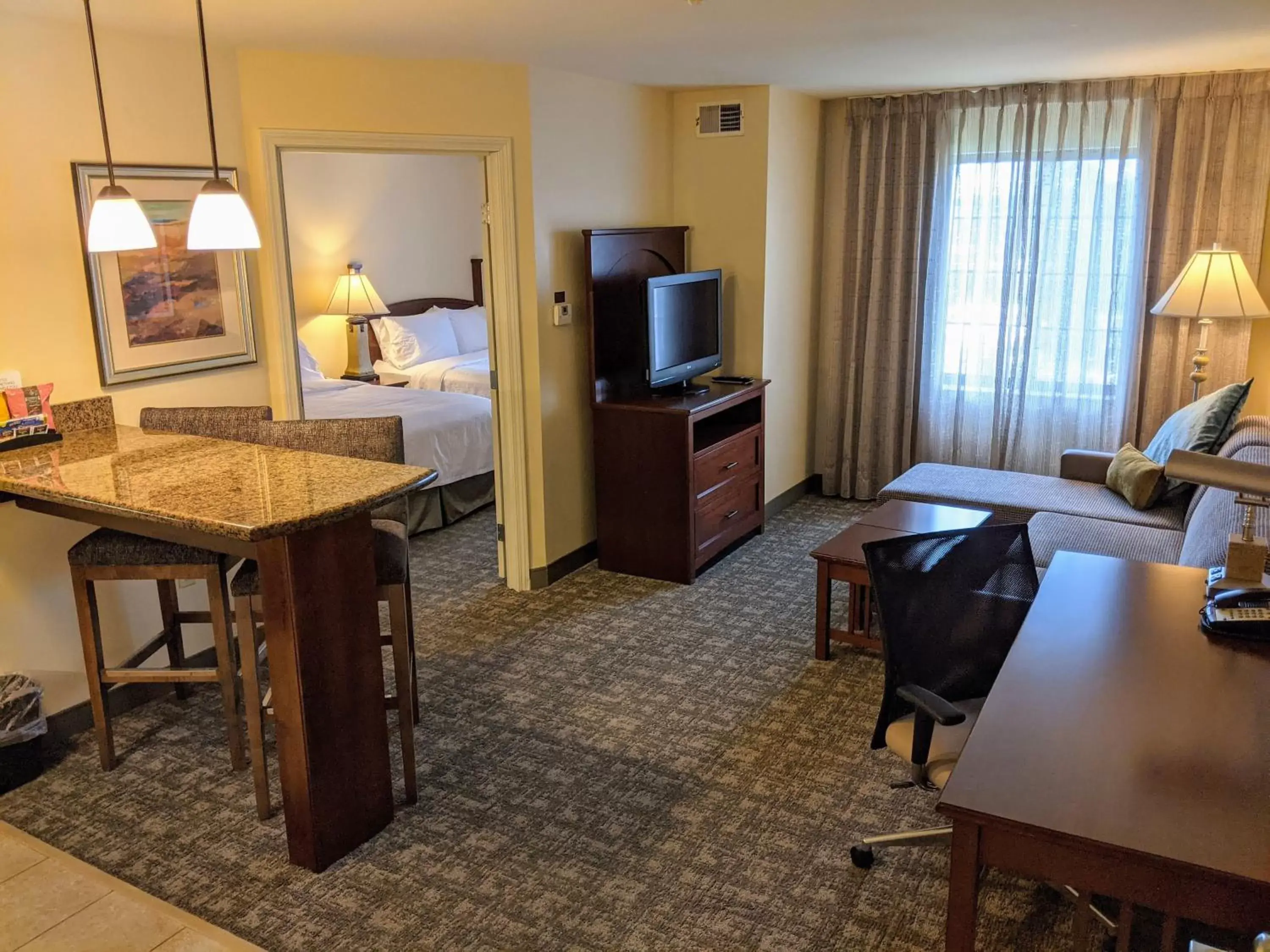 Photo of the whole room, TV/Entertainment Center in Staybridge Suites Indianapolis-Carmel, an IHG Hotel