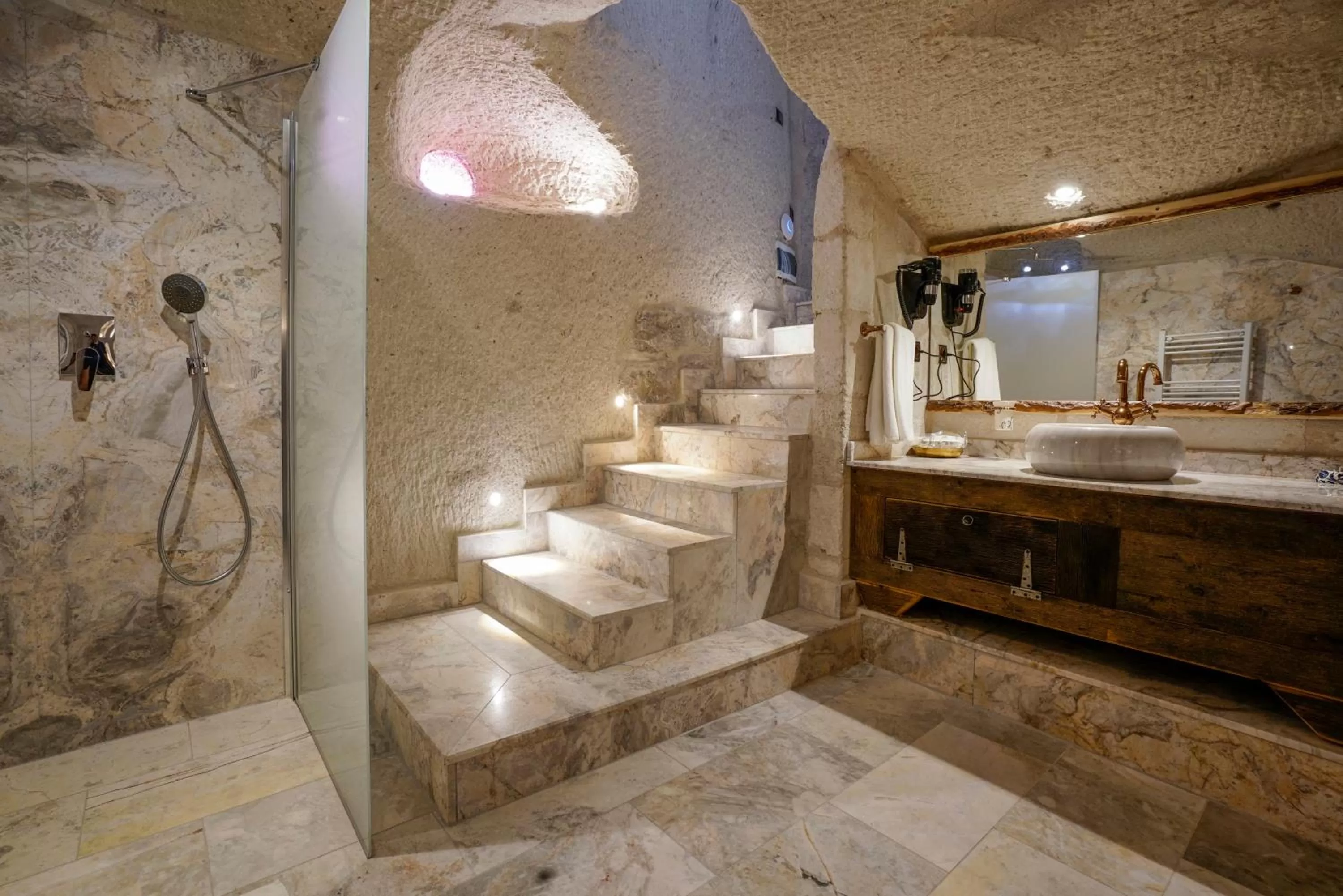 Bathroom in Artemis Cave Suites & Spa- Adults Only