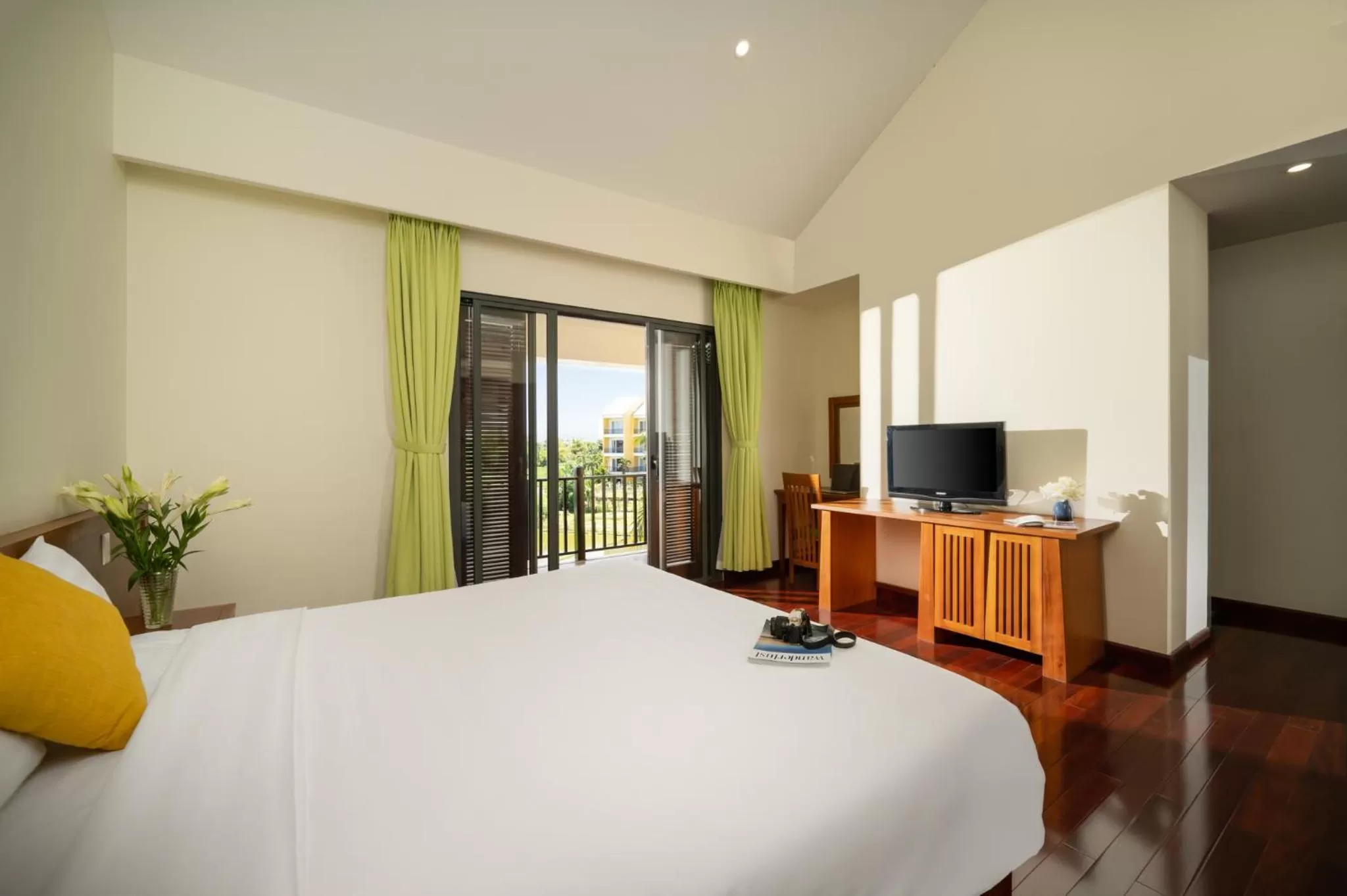 Bed, TV/Entertainment Center in Palm Village Hoian - STAY 24H