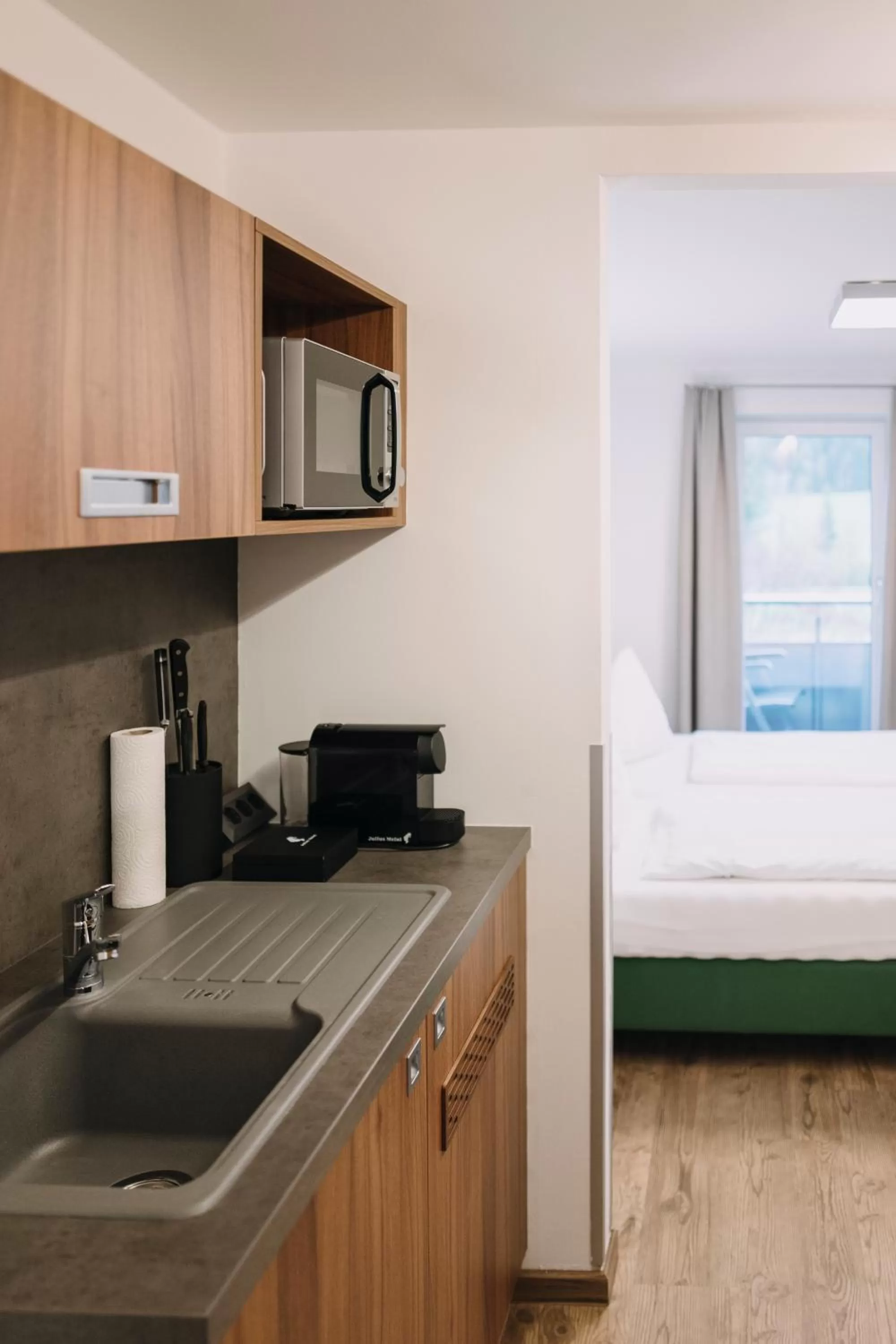 Kitchen or kitchenette, Bed in Hotel Aichingerwirt