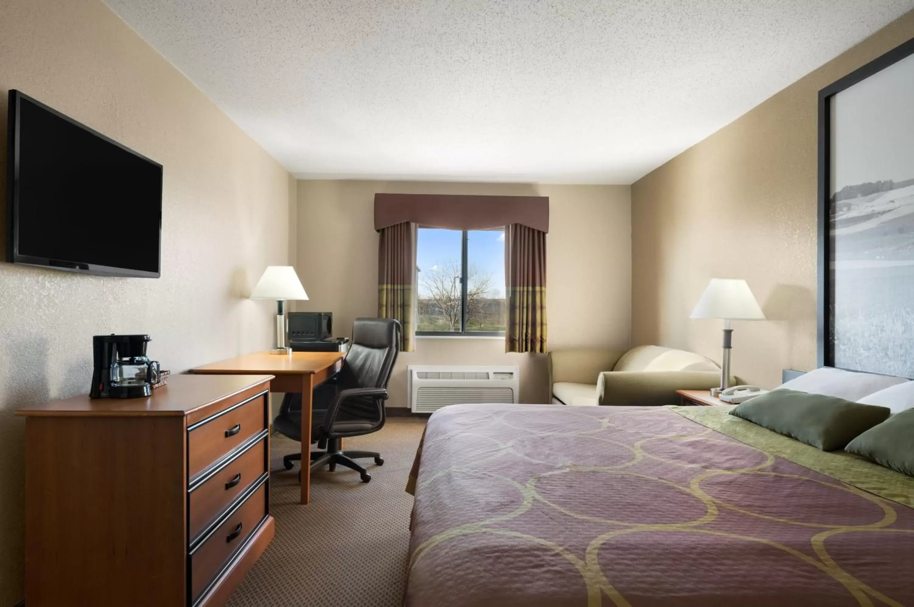 Photo of the whole room, TV/Entertainment Center in Super 8 by Wyndham Green Bay I-43 Bus. Park