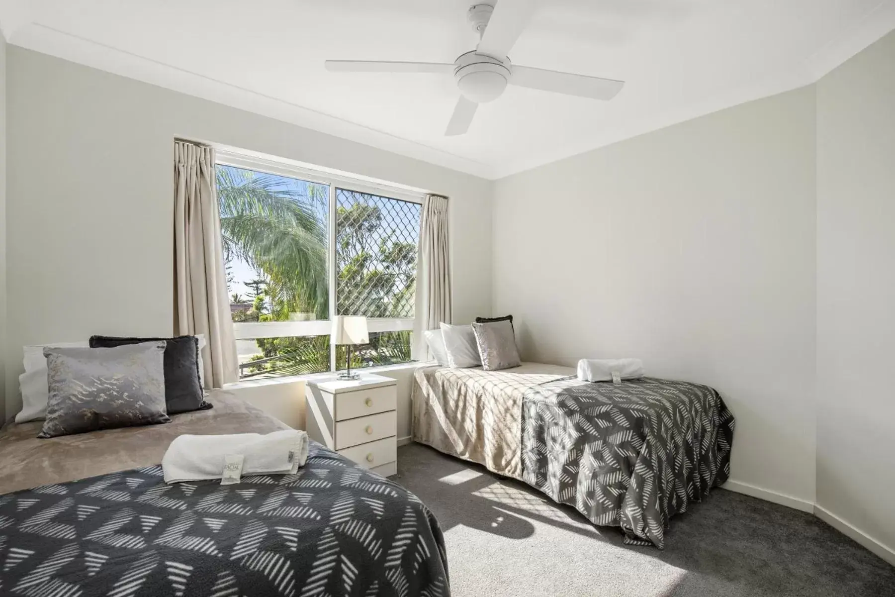 Bed in Kirra Palms Holiday Apartments