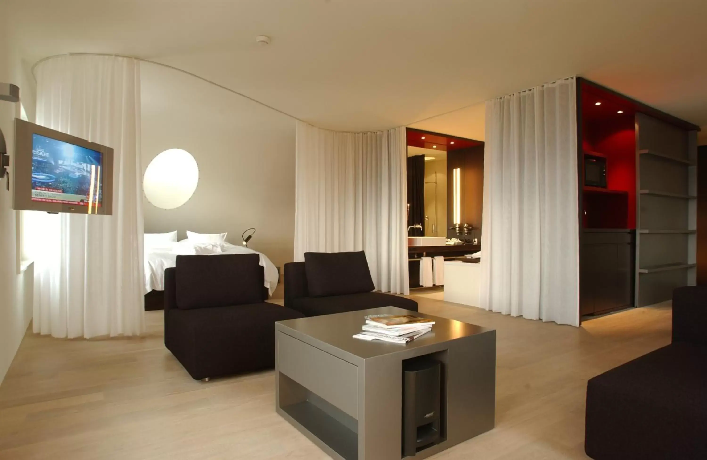 Living room, TV/Entertainment Center in Sorell Hotel Rigiblick - Studios & Spa Suites