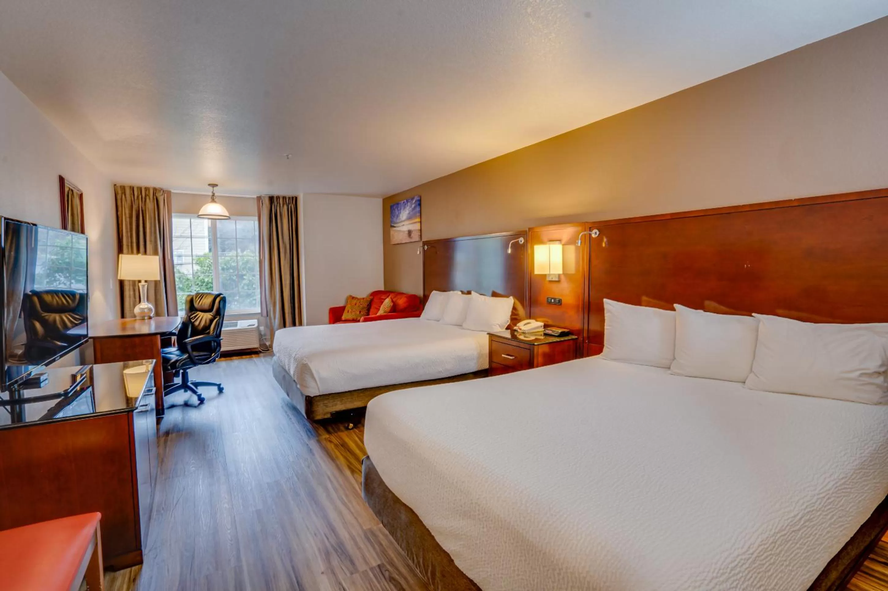 Bed in The Ashley Inn & Suites