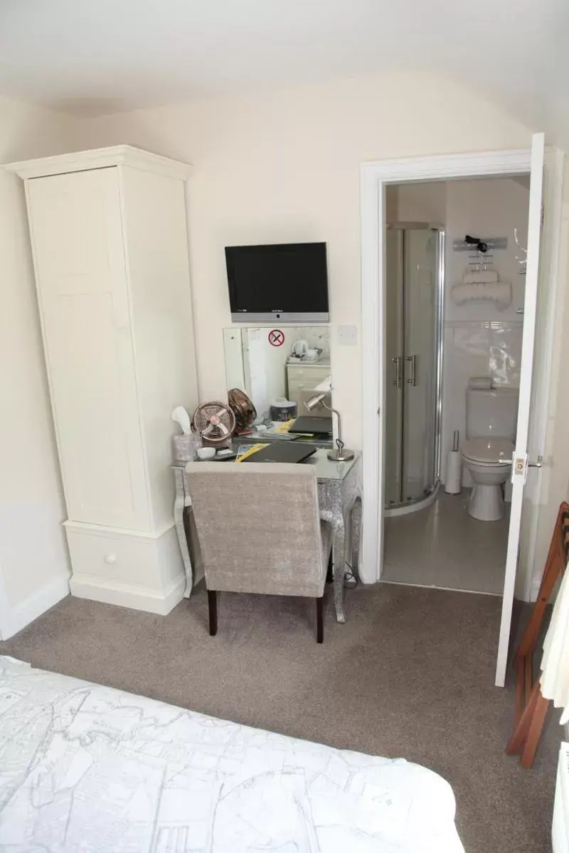 Photo of the whole room, TV/Entertainment Center in The Hinton Guest House