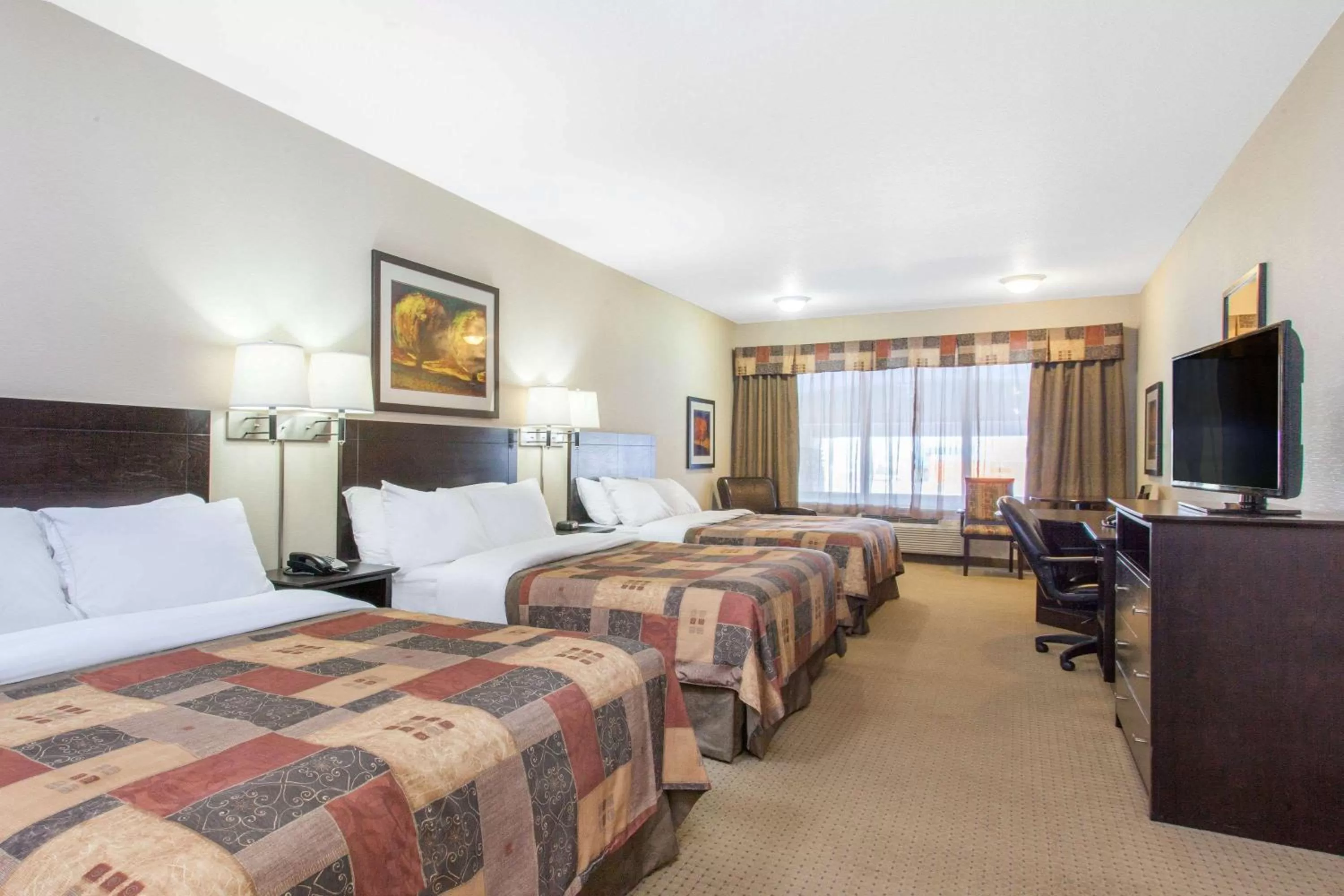 Photo of the whole room, Bed in Ramada by Wyndham Pincher Creek