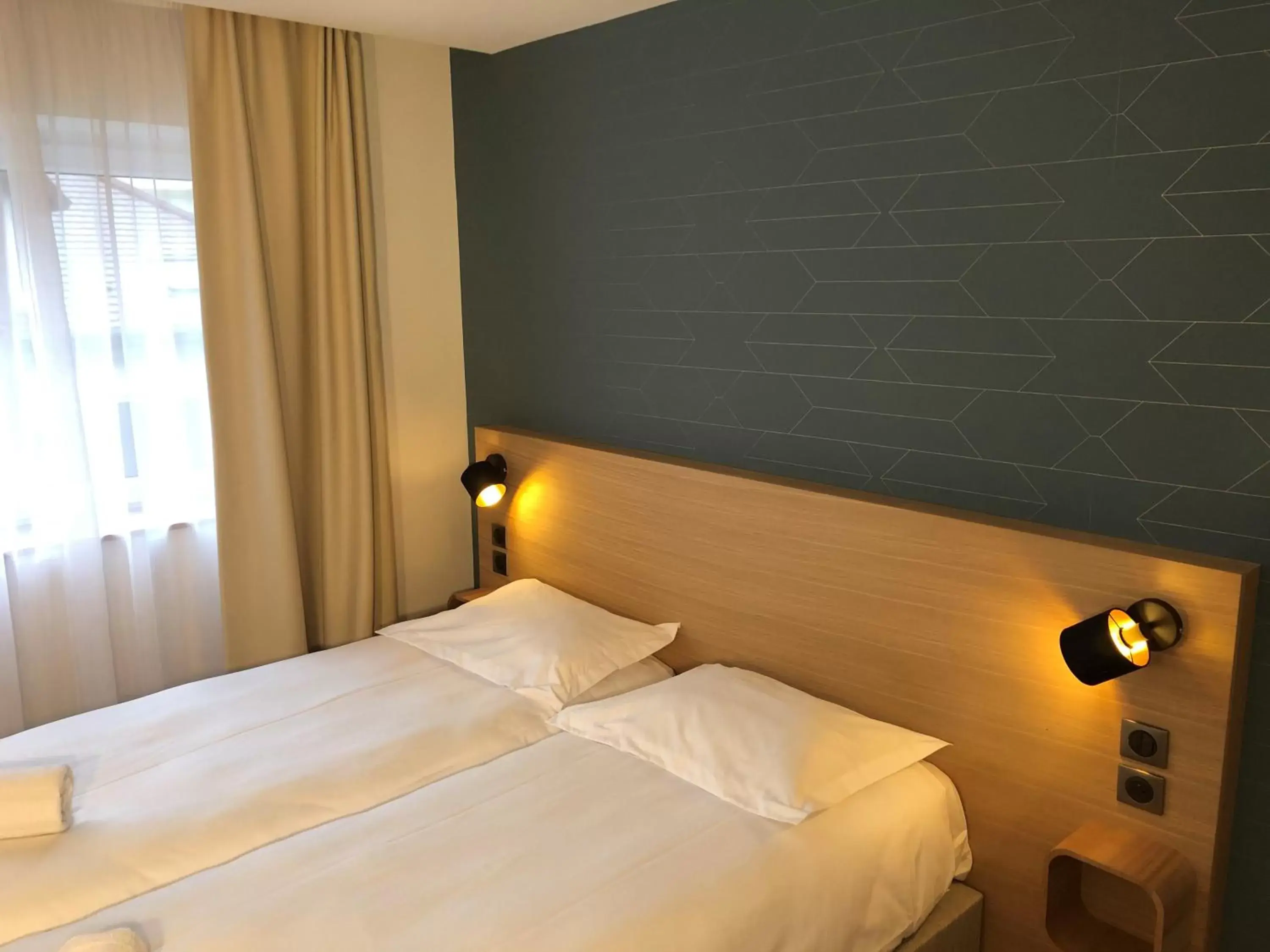 Bed in Oskar Hotel