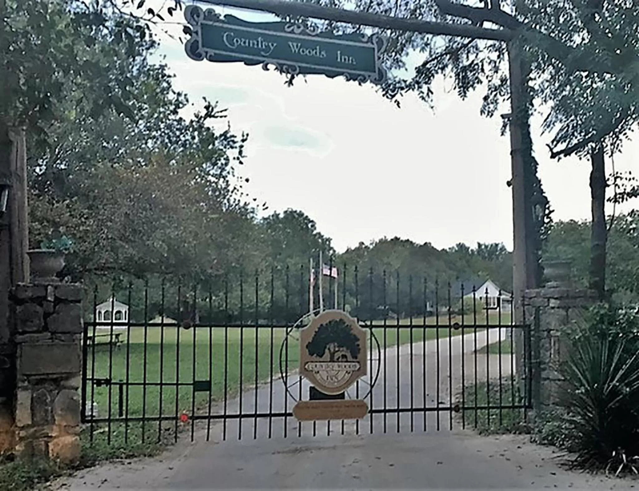 Property logo or sign in Country Woods Inn