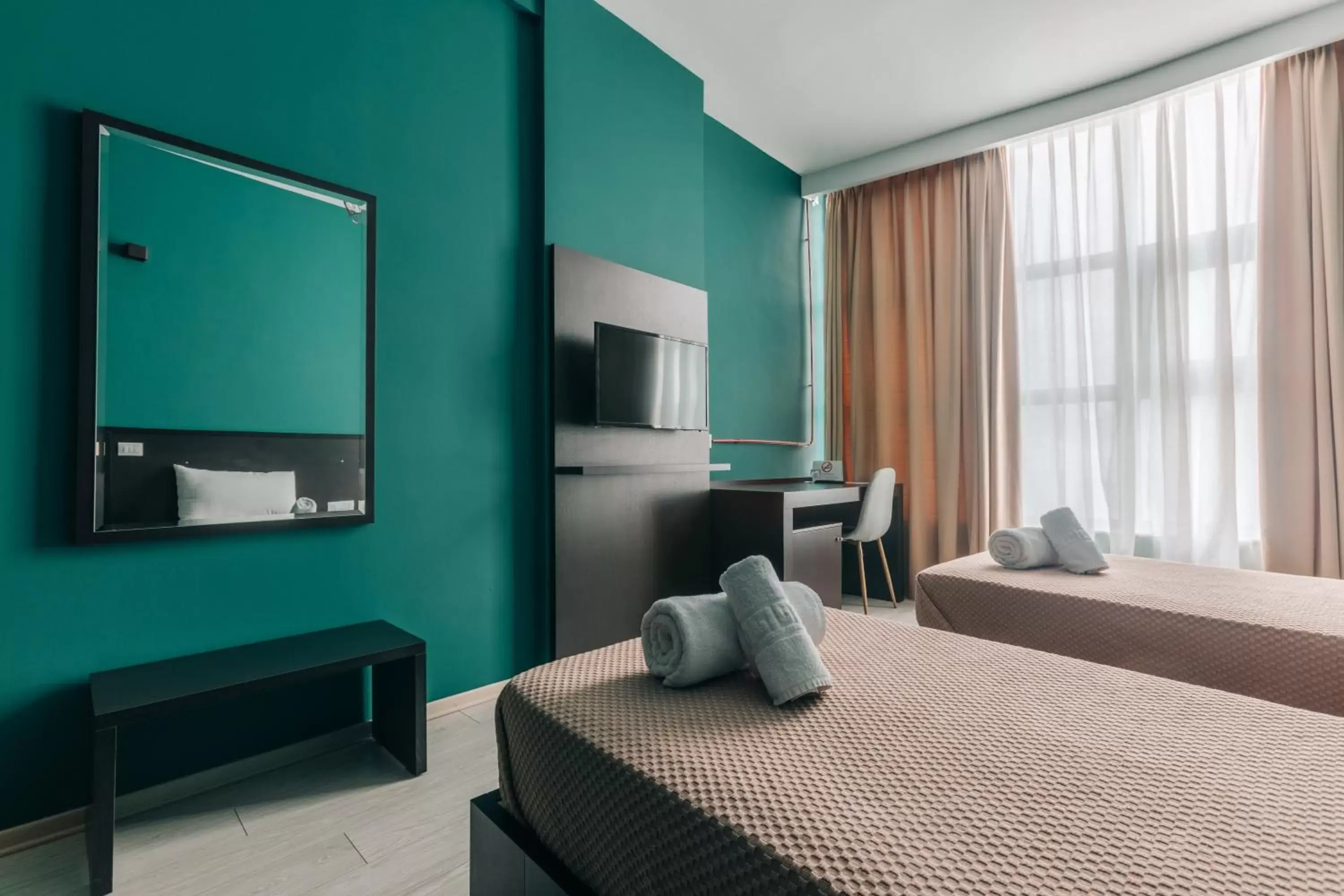 Communal lounge/ TV room, Bed in Arc Hotel Tirana