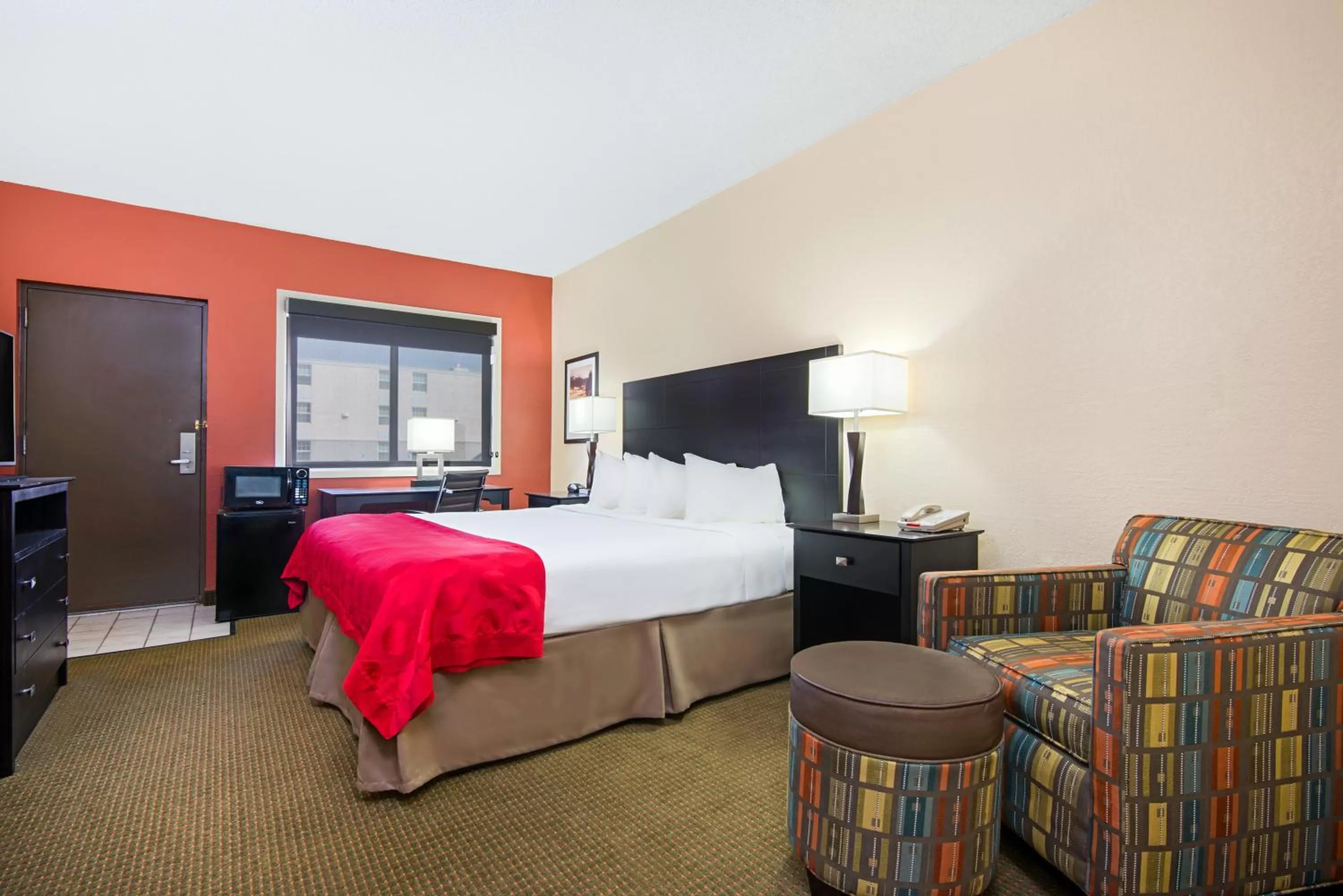 Bed in Ramada Plaza by Wyndham Gillette Conference Center