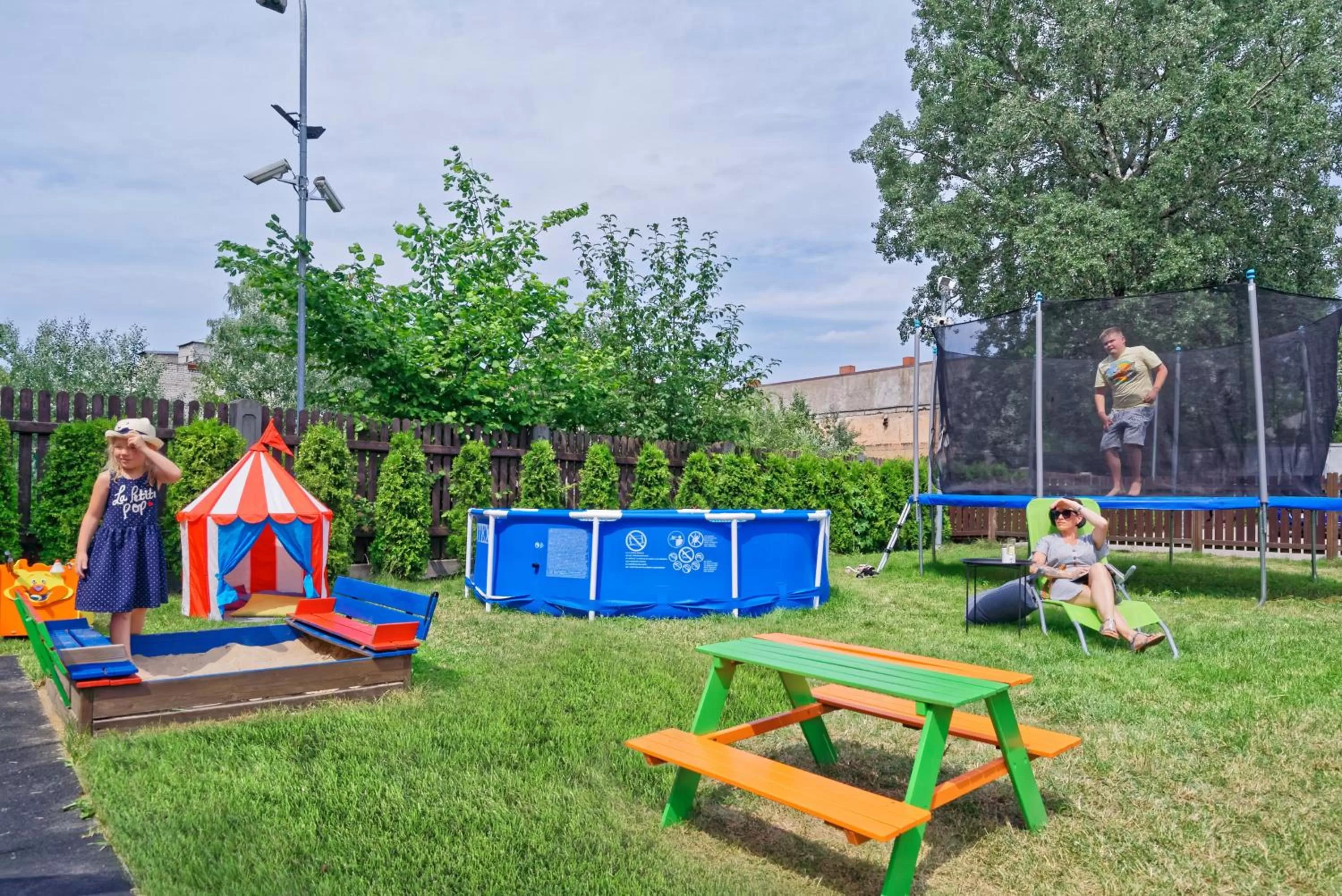 Children play ground in RIGAAPARTMENT SONADA Family Aparthotel - Private Parking