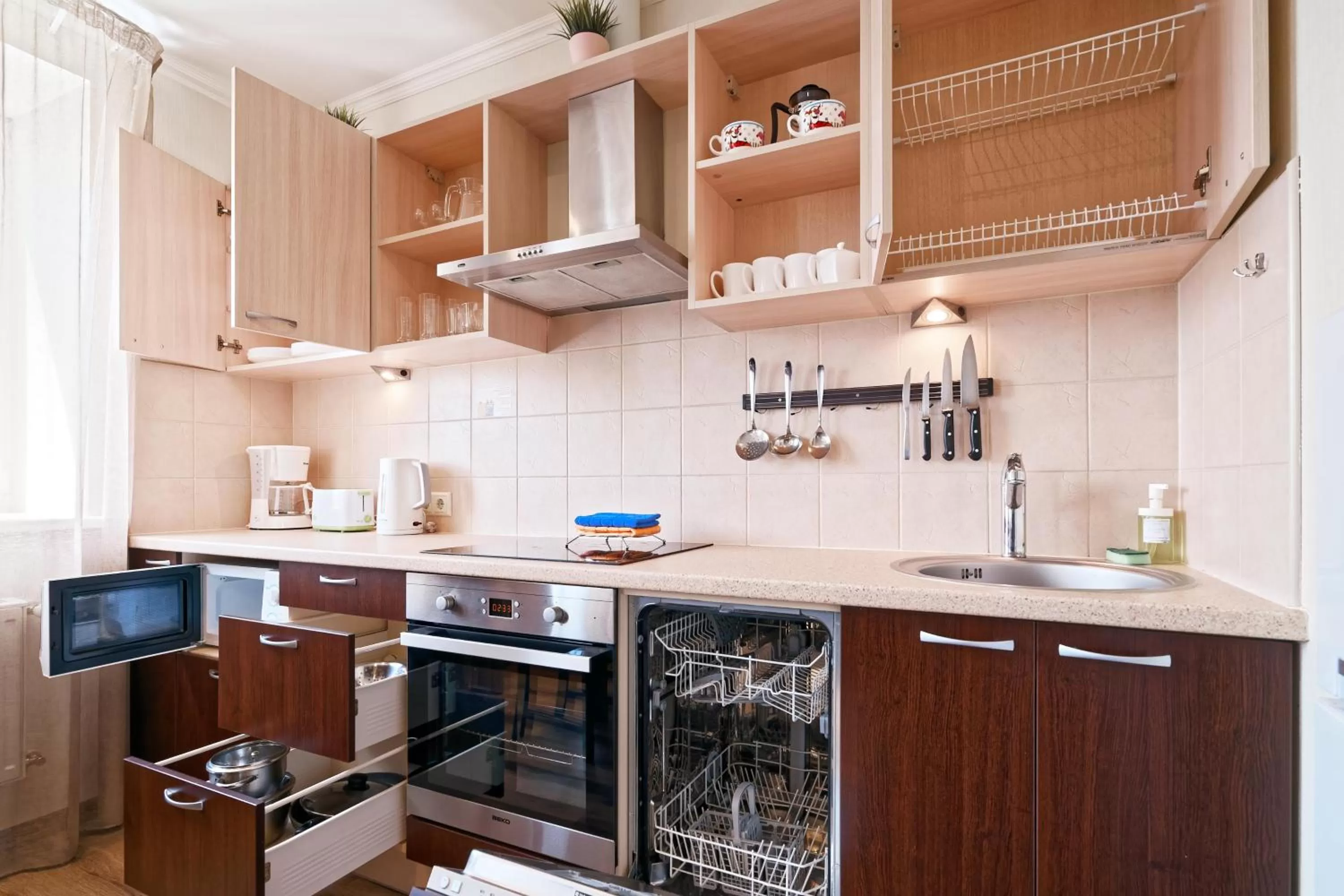 Kitchen or kitchenette in RIGAAPARTMENT SONADA Family Aparthotel - Private Parking