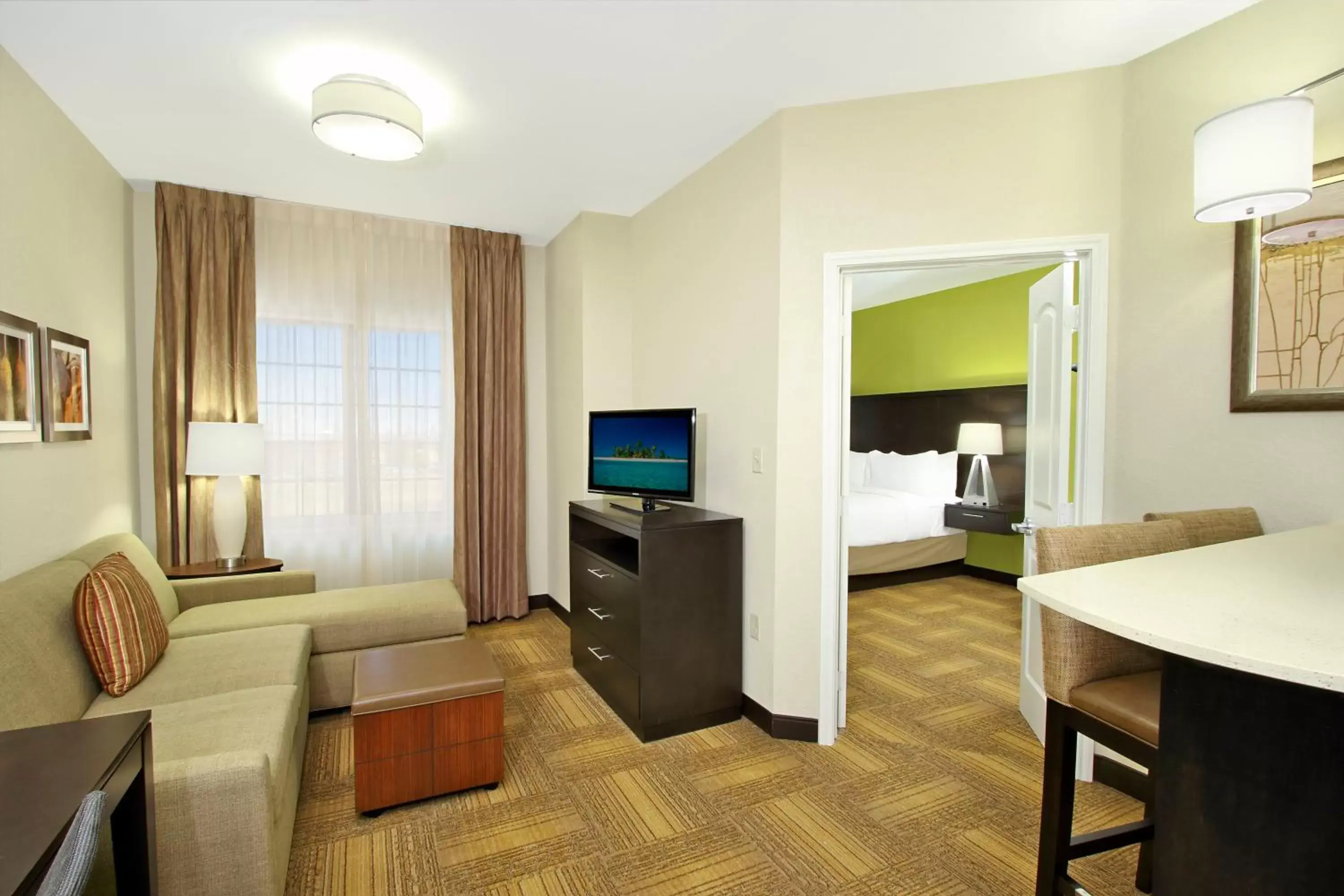 Bedroom, Seating Area in Staybridge Suites - Odessa - Interstate HWY 20, an IHG Hotel