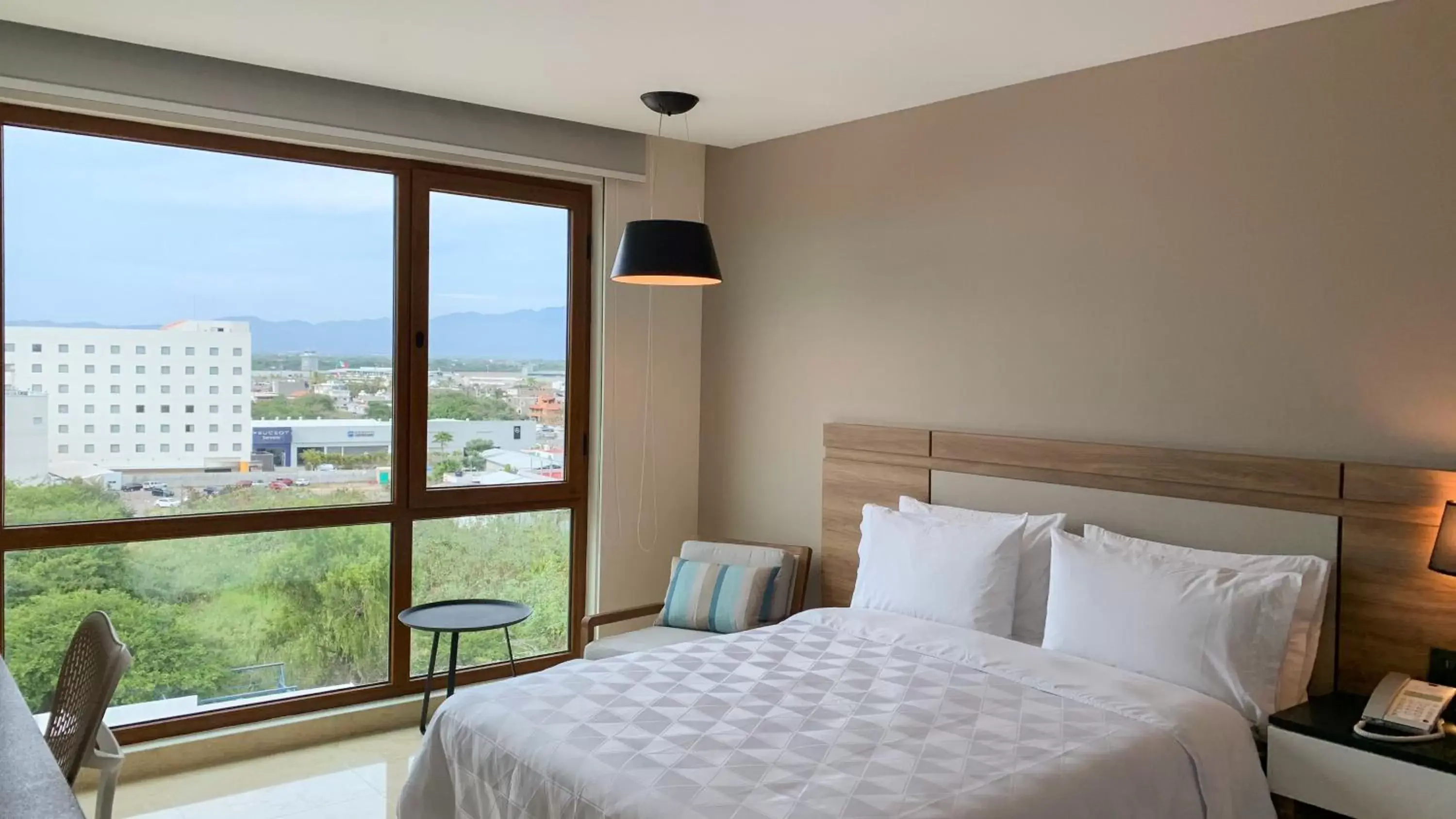 Photo of the whole room, Bed in Holiday Inn & Suites - Puerto Vallarta Marina & Golf, an IHG Hotel