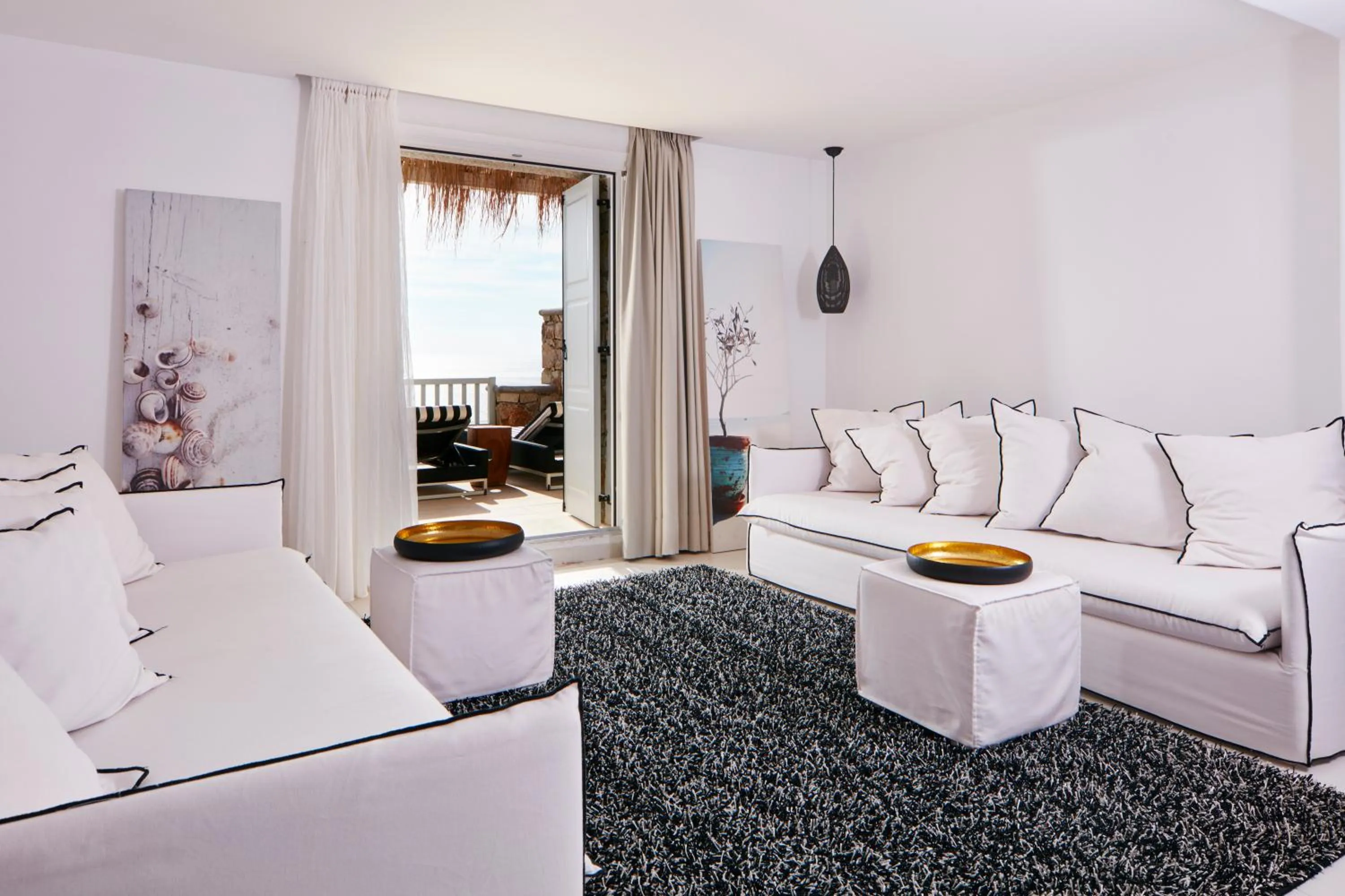 Seating area, Bed in Myconian Villa Collection - Preferred Hotels & Resorts