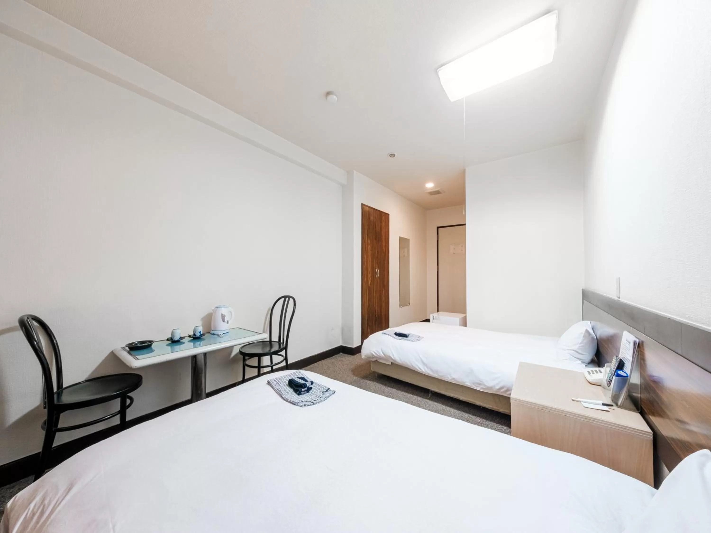 Bed in Tabist Hotel Tetora Hakodate Station