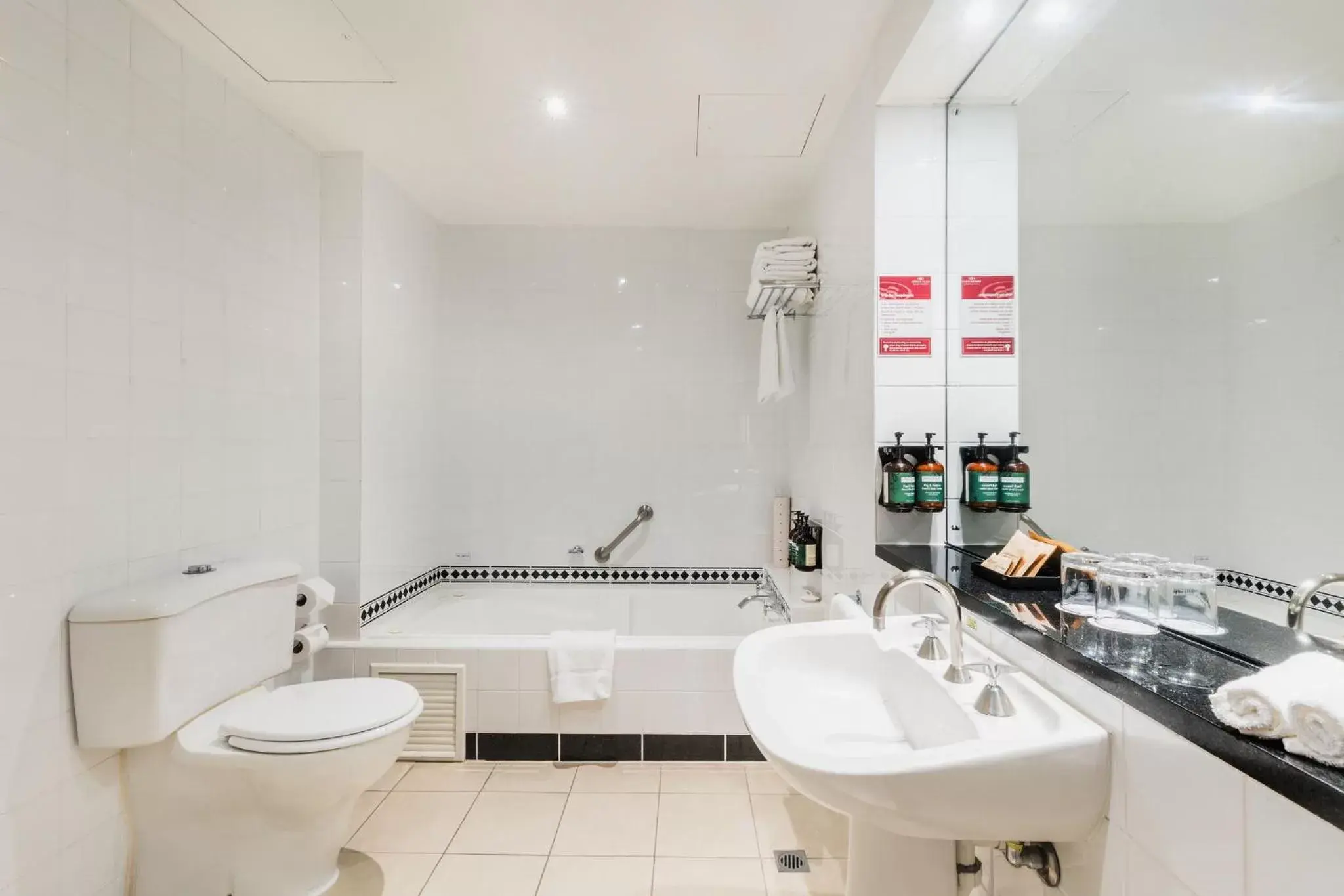 Toilet, Bathroom in Crowne Plaza Canberra, an IHG Hotel