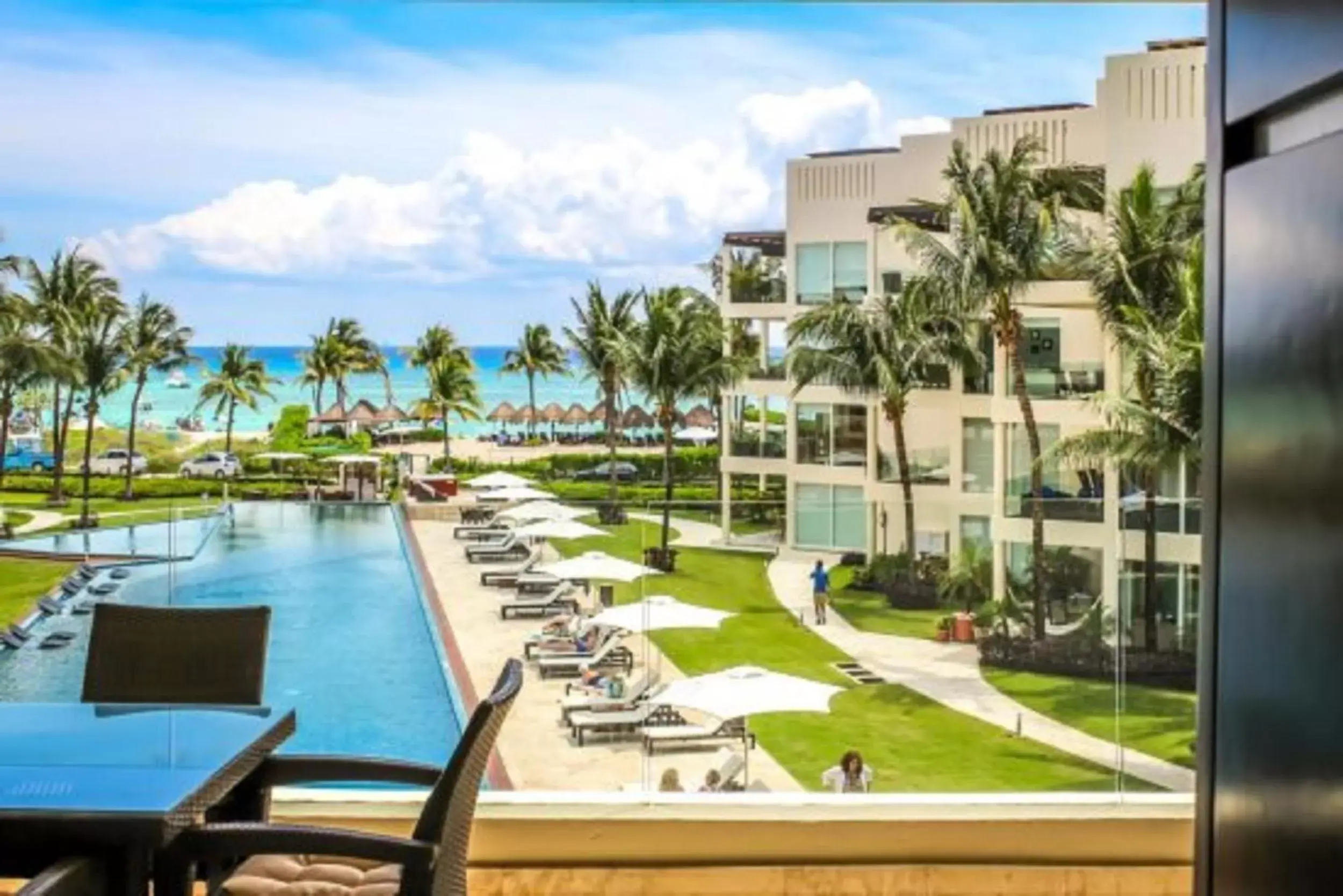 Balcony/Terrace, Pool View in The Elements Oceanfront & Beachside Condo Hotel