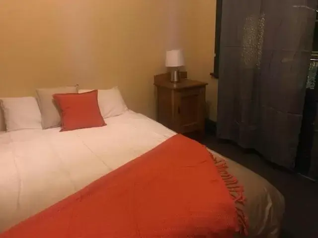 Bed in Bellbird Hotel