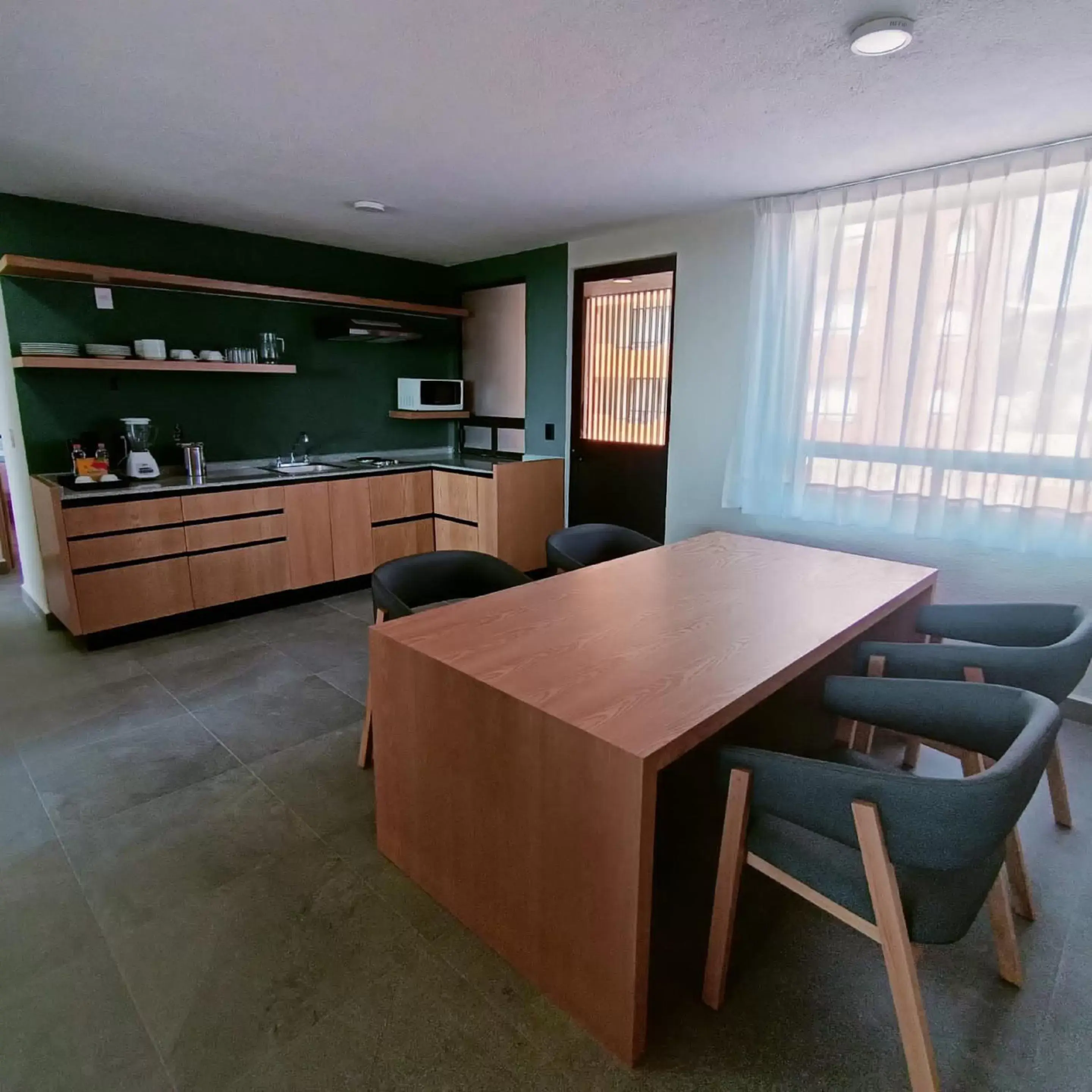 Dining area, Kitchen/Kitchenette in Sunrock Hotel & Suites