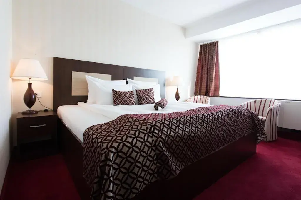 Bed in Grand Hotel Napoca