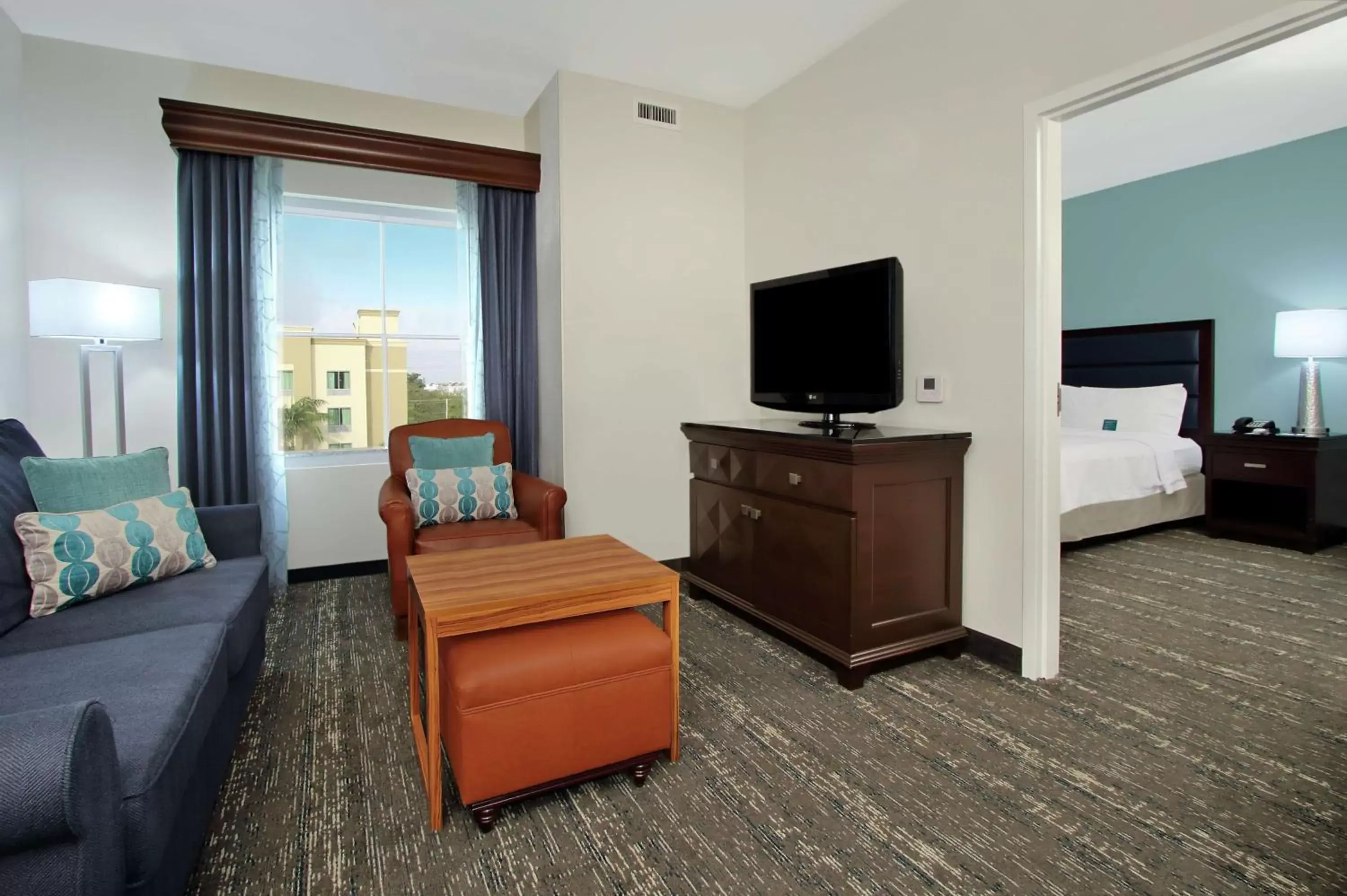 Living room, TV/Entertainment Center in Homewood Suites by Hilton Fort Lauderdale Airport-Cruise Port